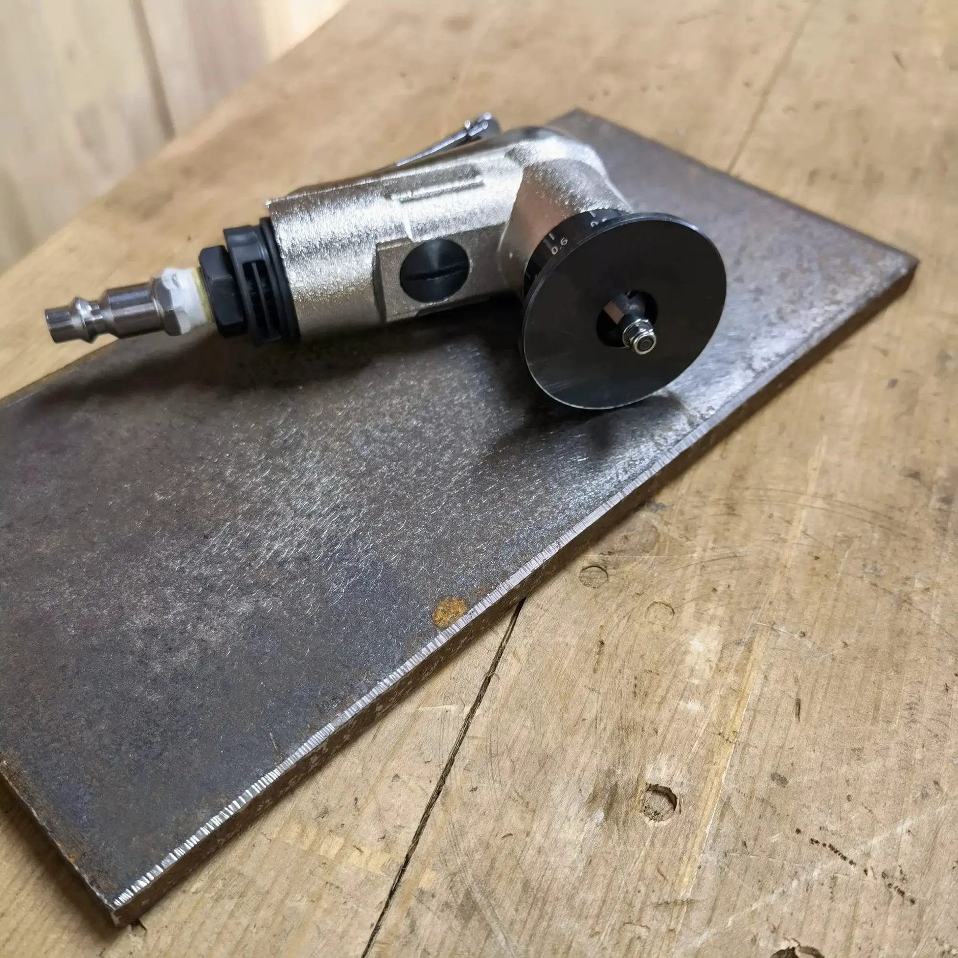 Lightweight Pneumatic Chamfer Tool For Metal Deburring, Tiny Yet Mighty Mini Air Beveler With Dual Cutter Head on wood surface