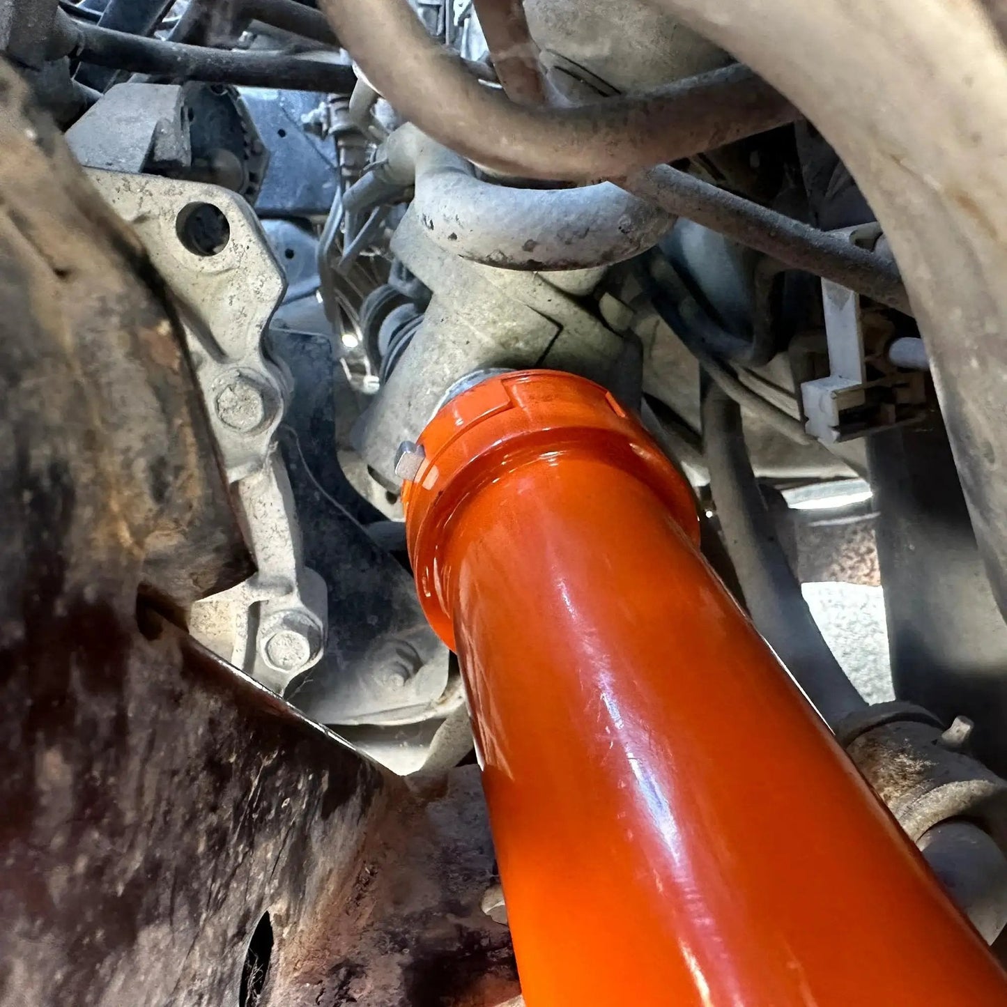 Close-up of Inner Tie Rod Removal Tool Set With 12 Crowfoot Adapters And Half Inch Drive in use on automotive steering system