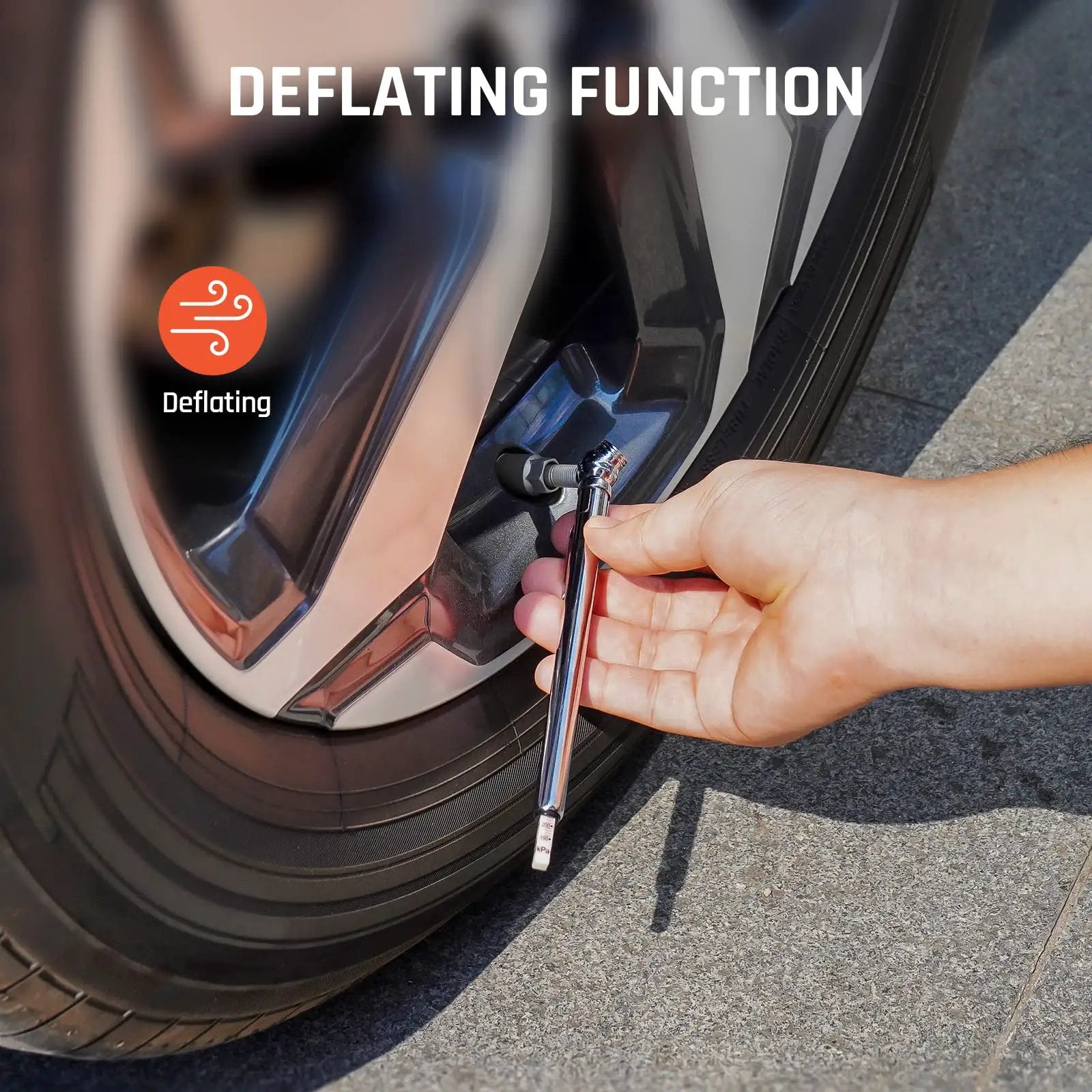Close-up of a hand using the Pencil Tire Pressure Gauge Set Two Pack With 16 Tire Caps And Dual Ranges 10 To 50 PSI And 20 To 120 PSI Stainless Steel Body For Cars Trucks RVs And Bicycles ANSI B40 1 Grade B to deflate a tire.