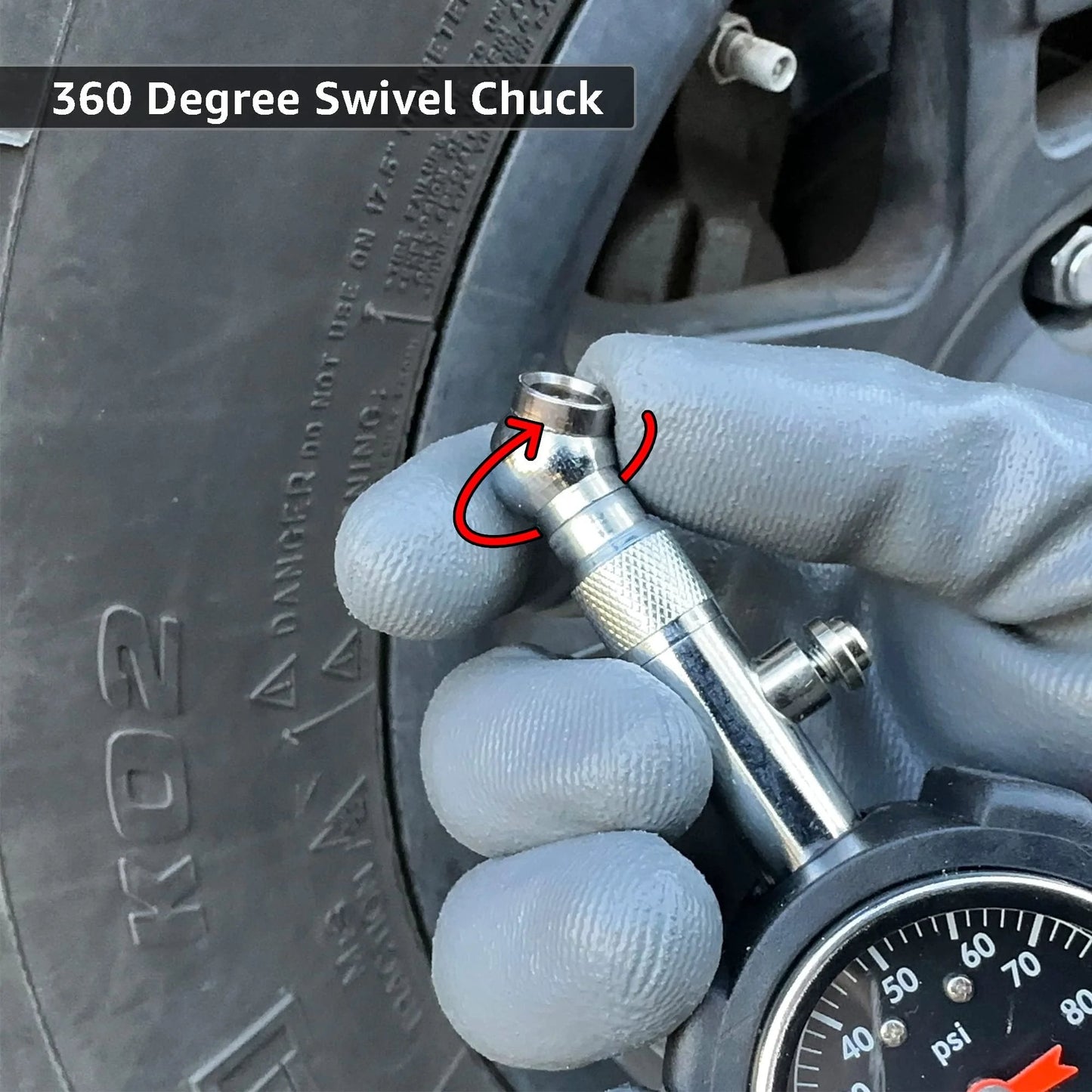 Close-up of Deluxe Tire Pressure Gauge For Cars And Bikes With 100 PSI Precision ANSI B40 1 Standard, held against tire valve.