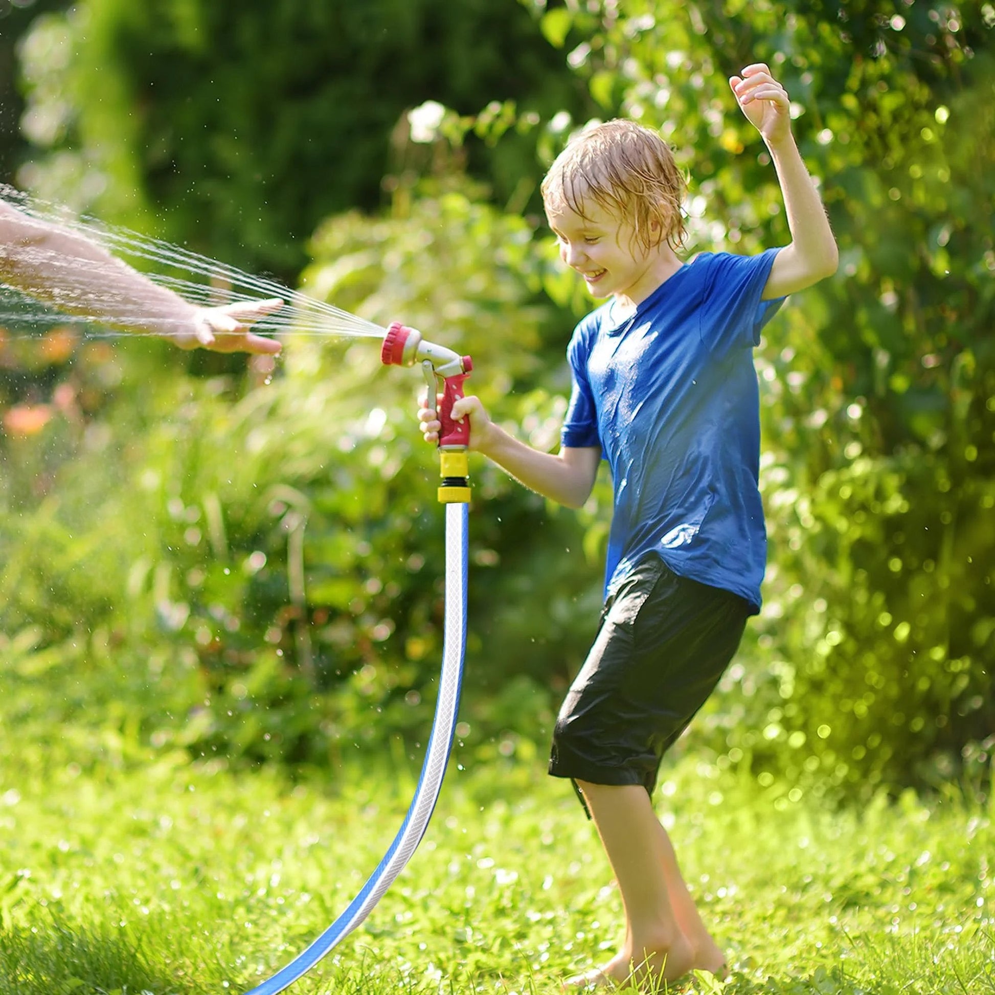 Child playing with Heavy Duty Short Garden Hose 3/4 Inch By 3 Foot Workhorse Water Pipe For Commercial Use, Kink Free No Leaks