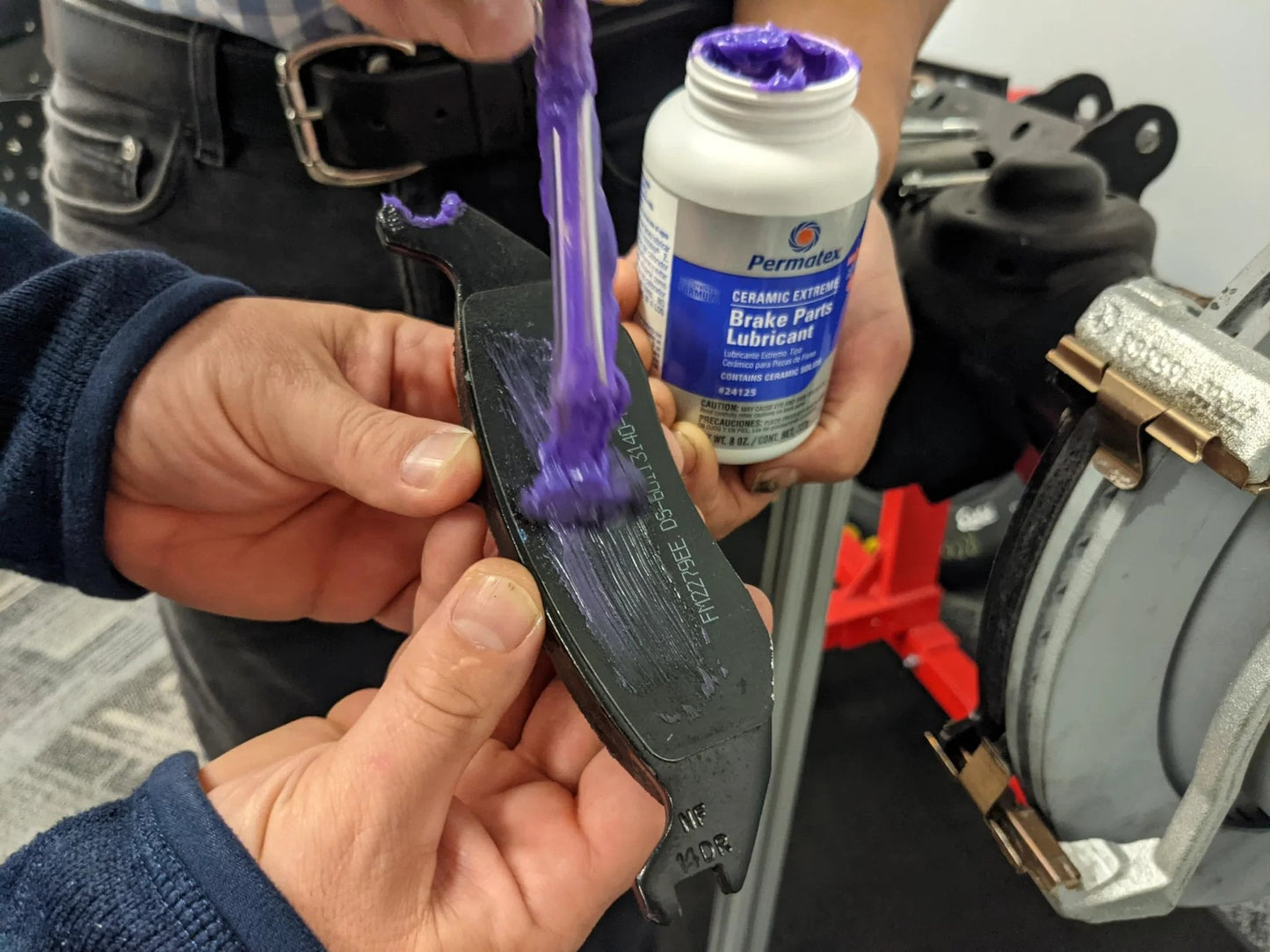 Applying Ceramic Extreme Brake Parts Lubricant For Disc And Drum Systems, 8 Oz From Permatex to brake pad with brush