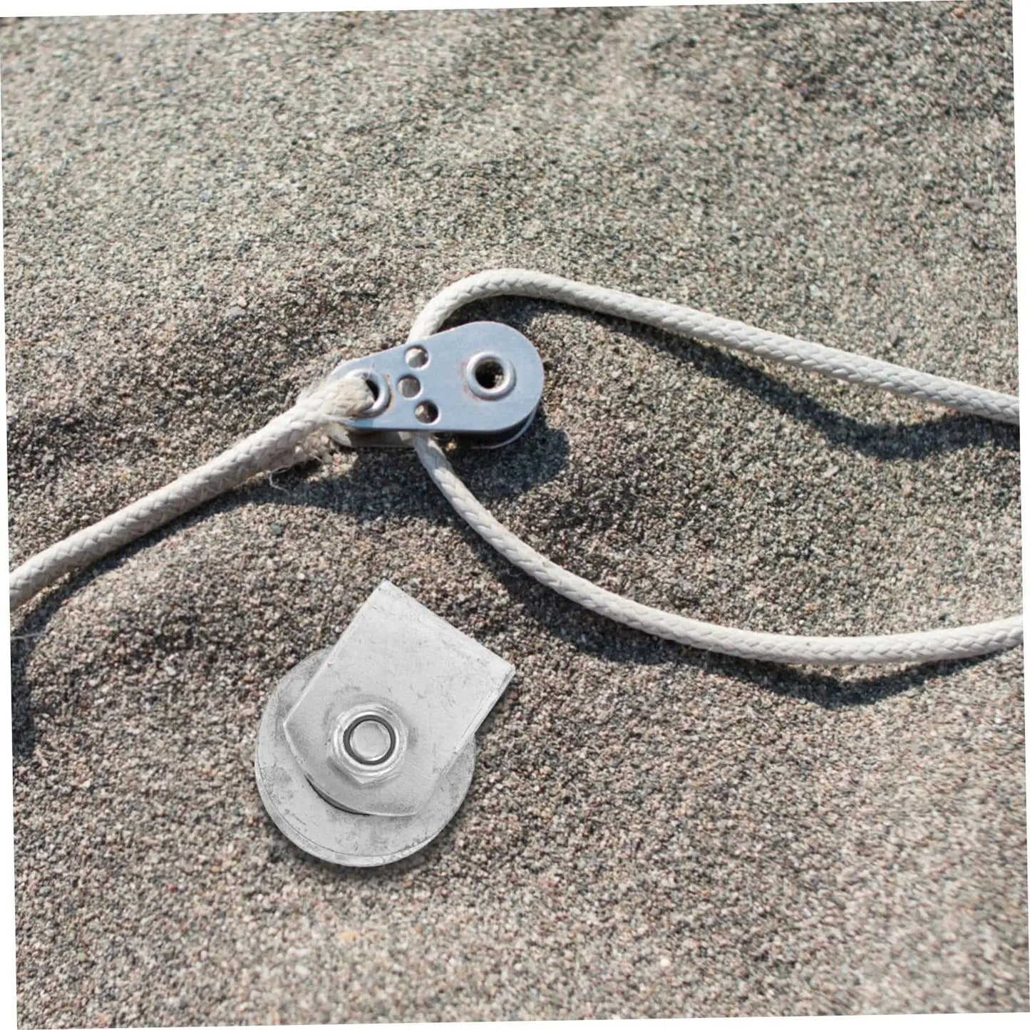 Rugged Cast Iron V Type Groove Wheel Garage Door Roller and rope on sand