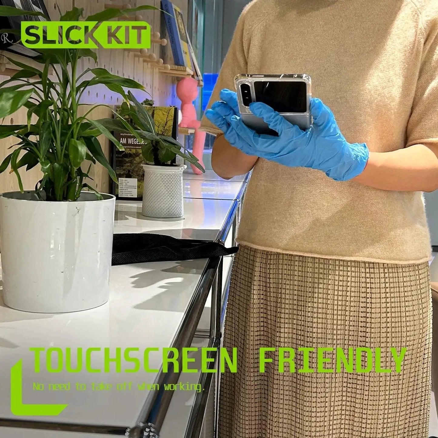 Person wearing blue 5 Mil Nitrile Gloves Latex Free Powder Free Textured Grip Automotive Cleaning using a touchscreen device.