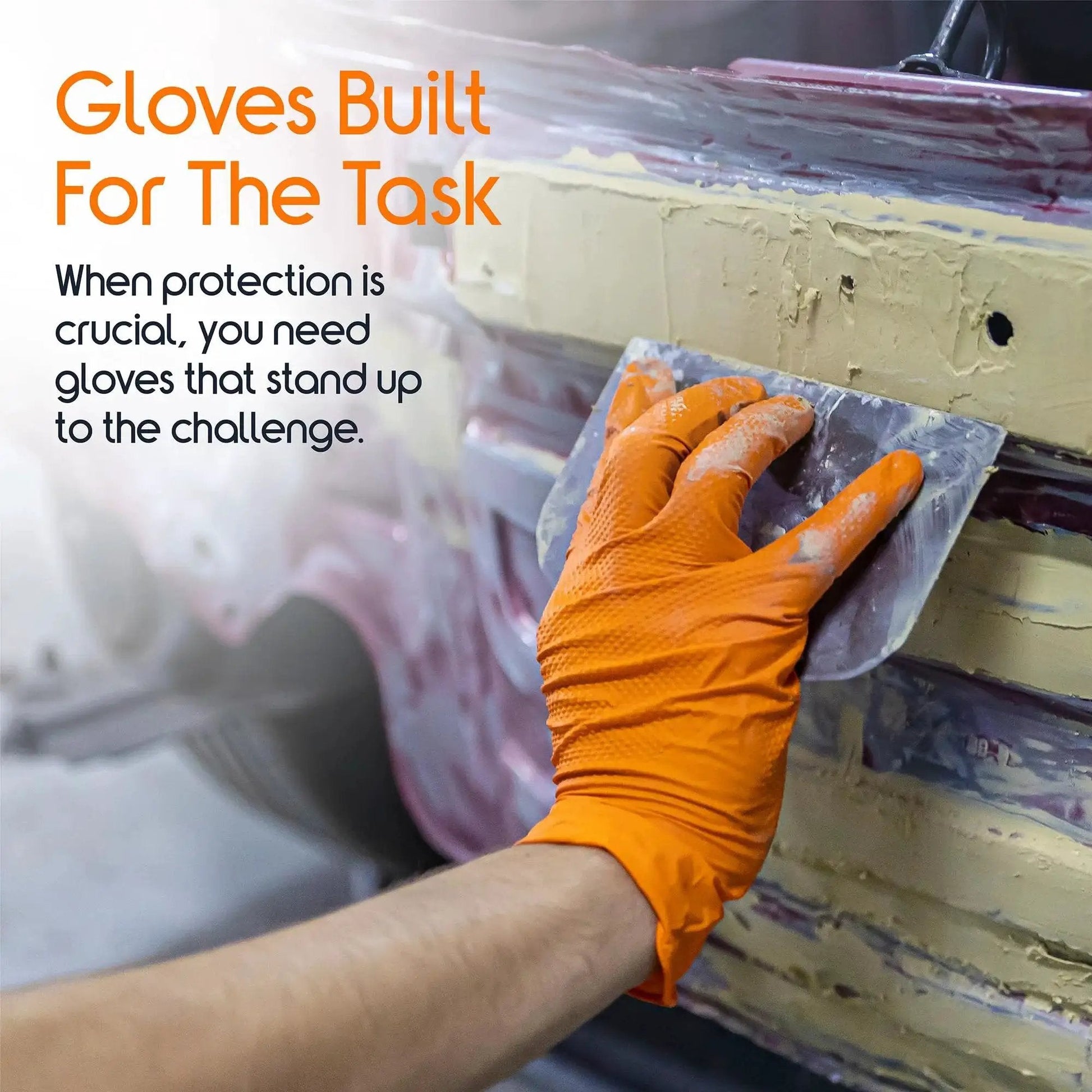 Hand wearing Orange Nitrile Gloves 8 Mil Heavy Duty Diamond Textured Grip Large 100 Count, uses scraper on vehicle body.