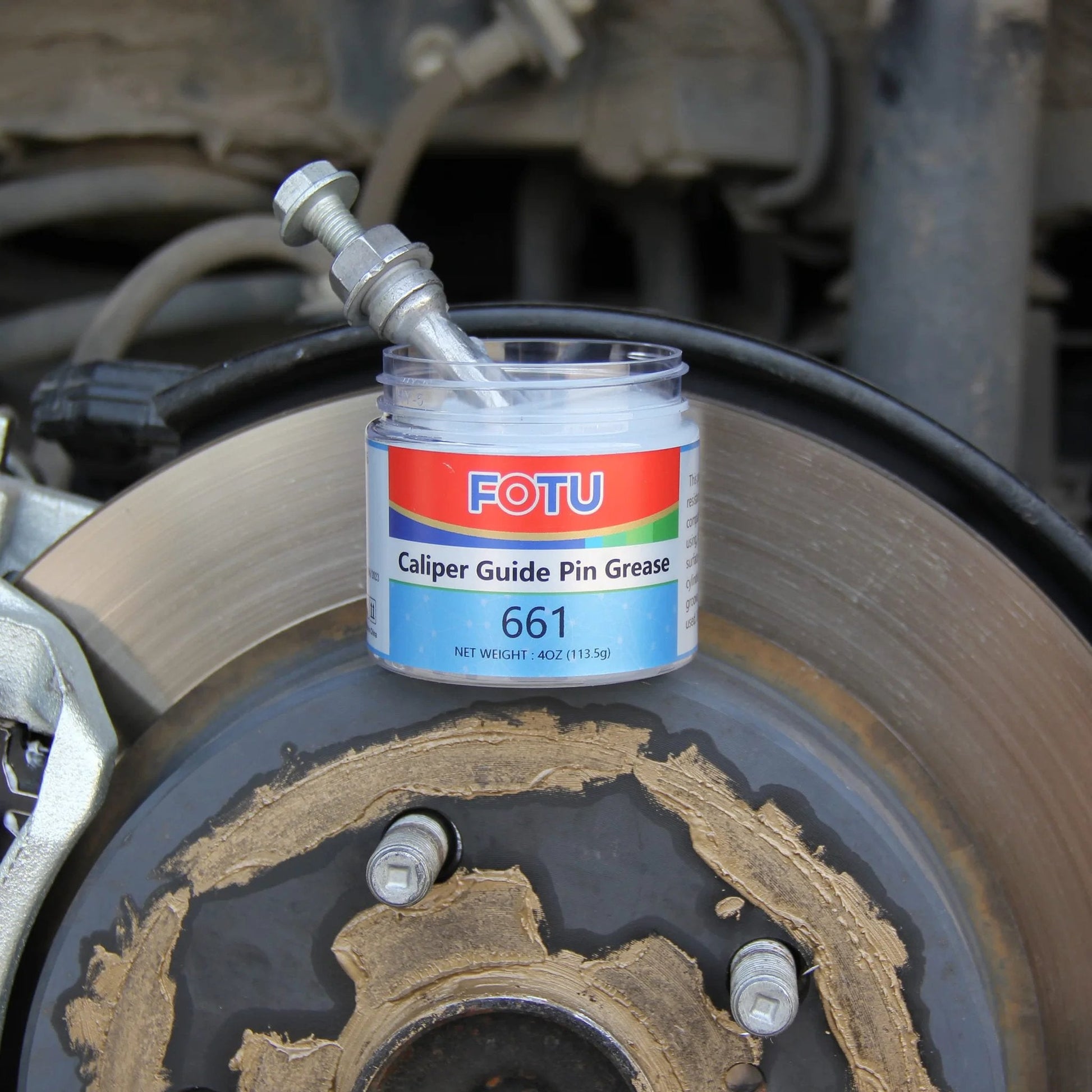 High Temperature Resistant Brake Caliper Guide Pin Lubricant For Smooth Braking And Long Lasting Performance Heavy Duty Suitable For Most Vehicles By FOTU 661 in use on a vehicle brake system