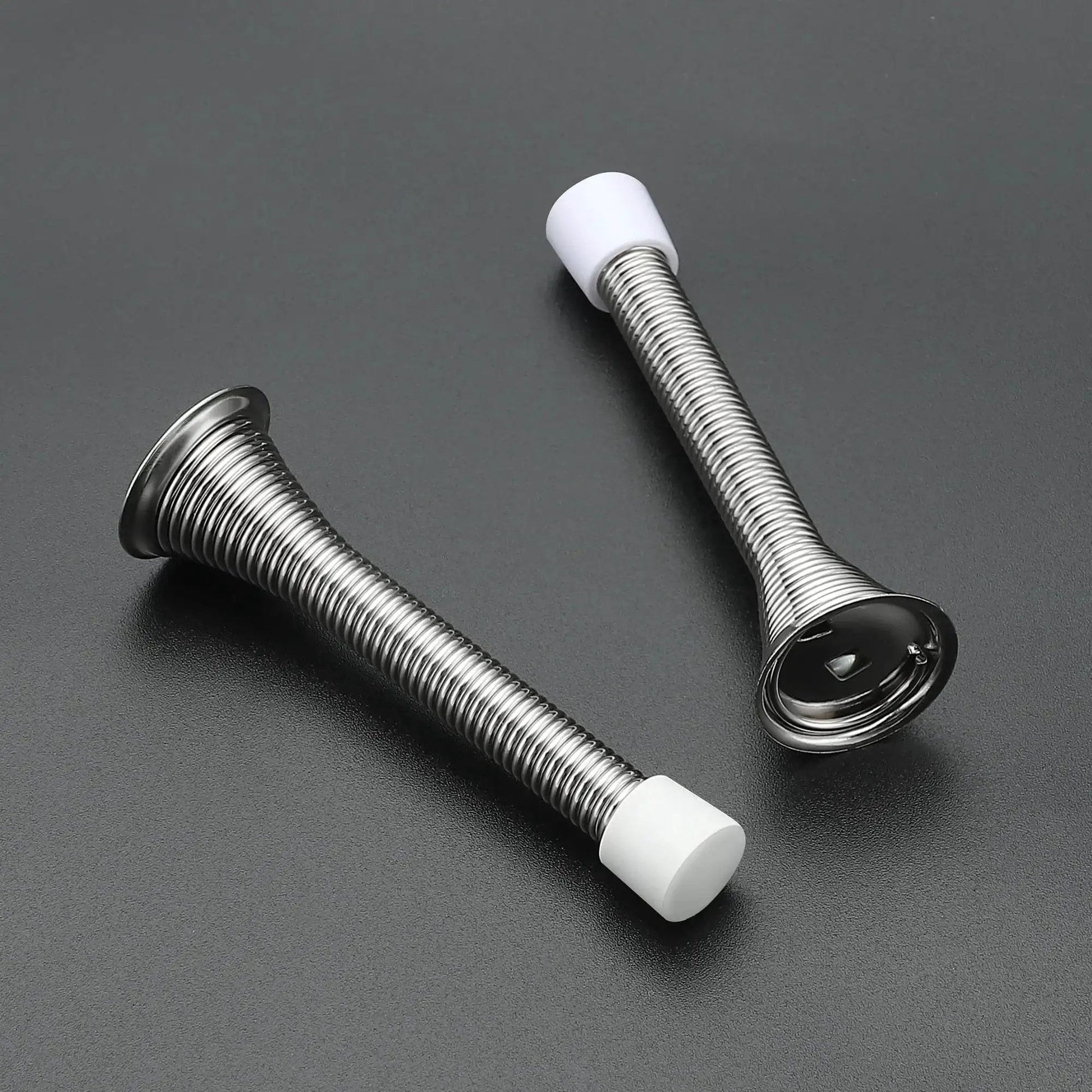 Spring Door Stops With Rubber Bumpers Satin Nickel 12 Pack For Bottom Of Door, showing two stops with rubber tips on black surface.
