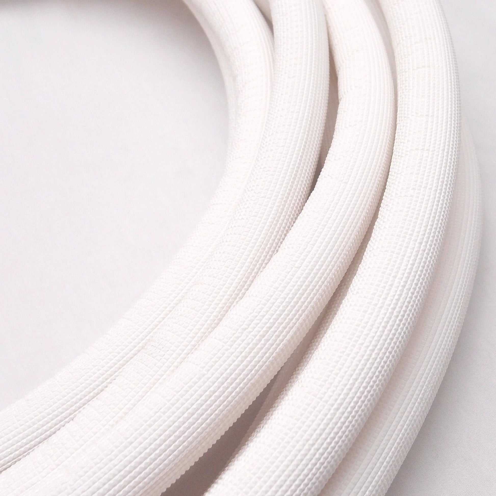 Quarter Inch Insulated Copper Coil Line For HVAC And Refrigeration, Seamless Copper Tube With Half Inch White Insulation, Close-Up