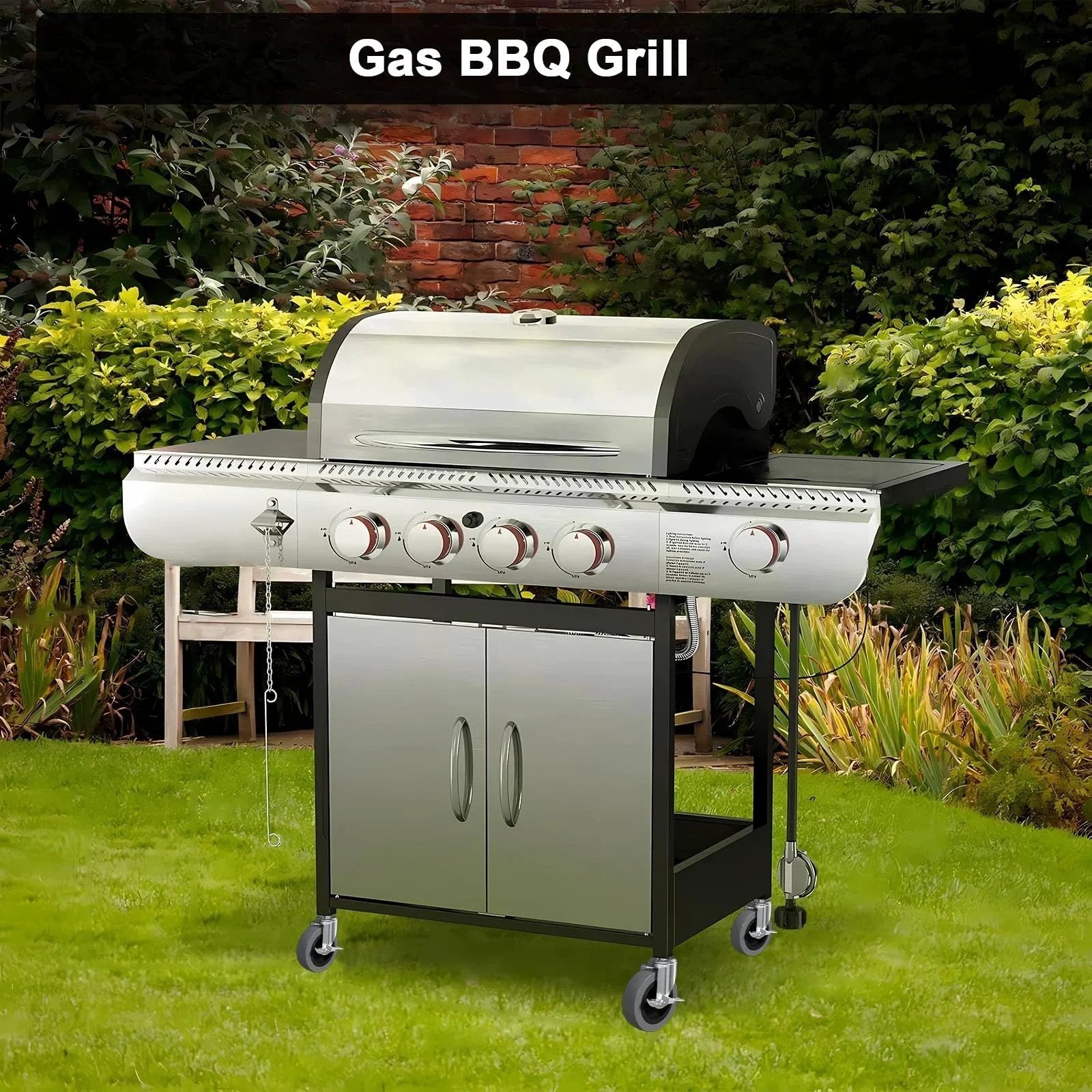 Outdoor gas BBQ grill with stainless steel burners and side shelves on a green lawn, surrounded by a brick wall and shrubbery.