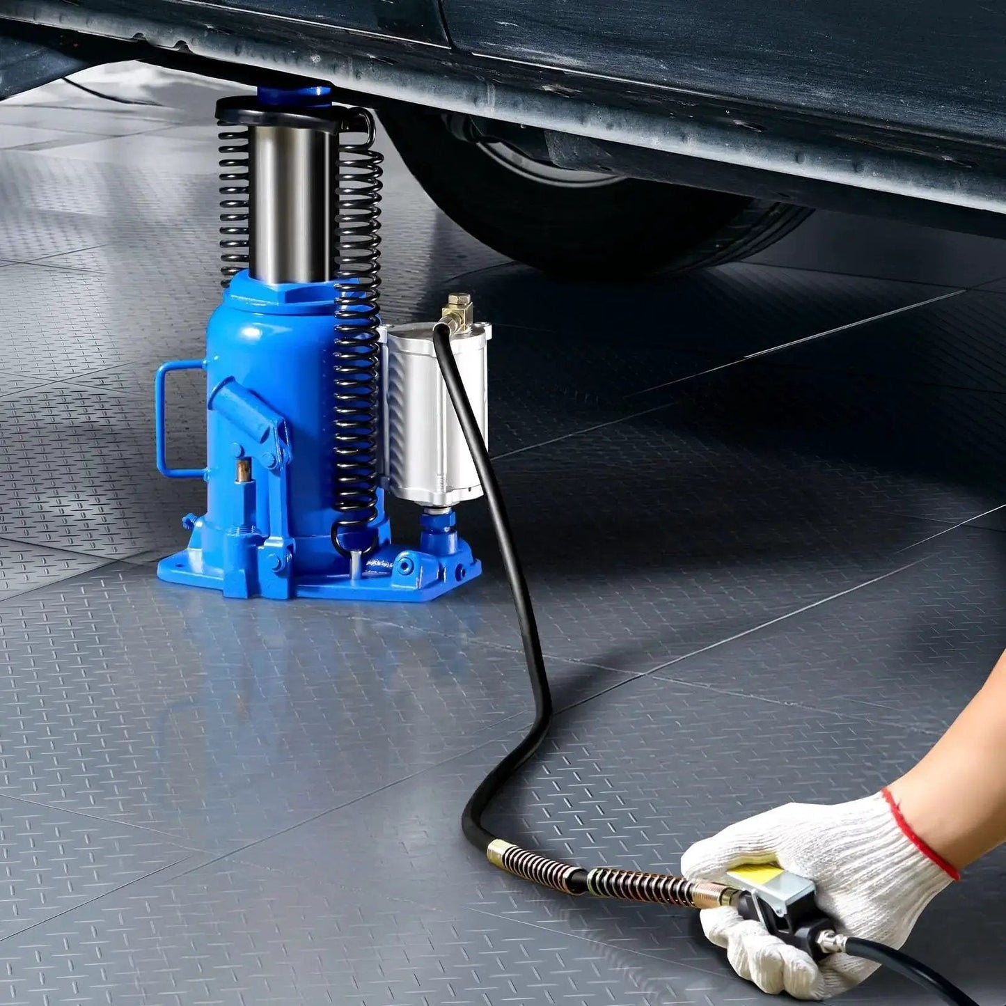Air Hydraulic Bottle Jack 32 Ton Floor Jack With Manual Pump And Pneumatic Lift positioned under vehicle