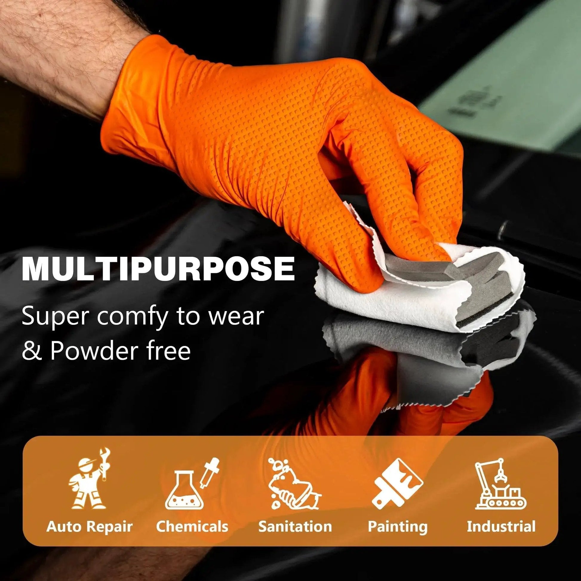 Hand wearing Industrial Nitrile Gloves Heavy Duty Diamond Textured Orange XL 100 Count cleaning a surface with a cloth
