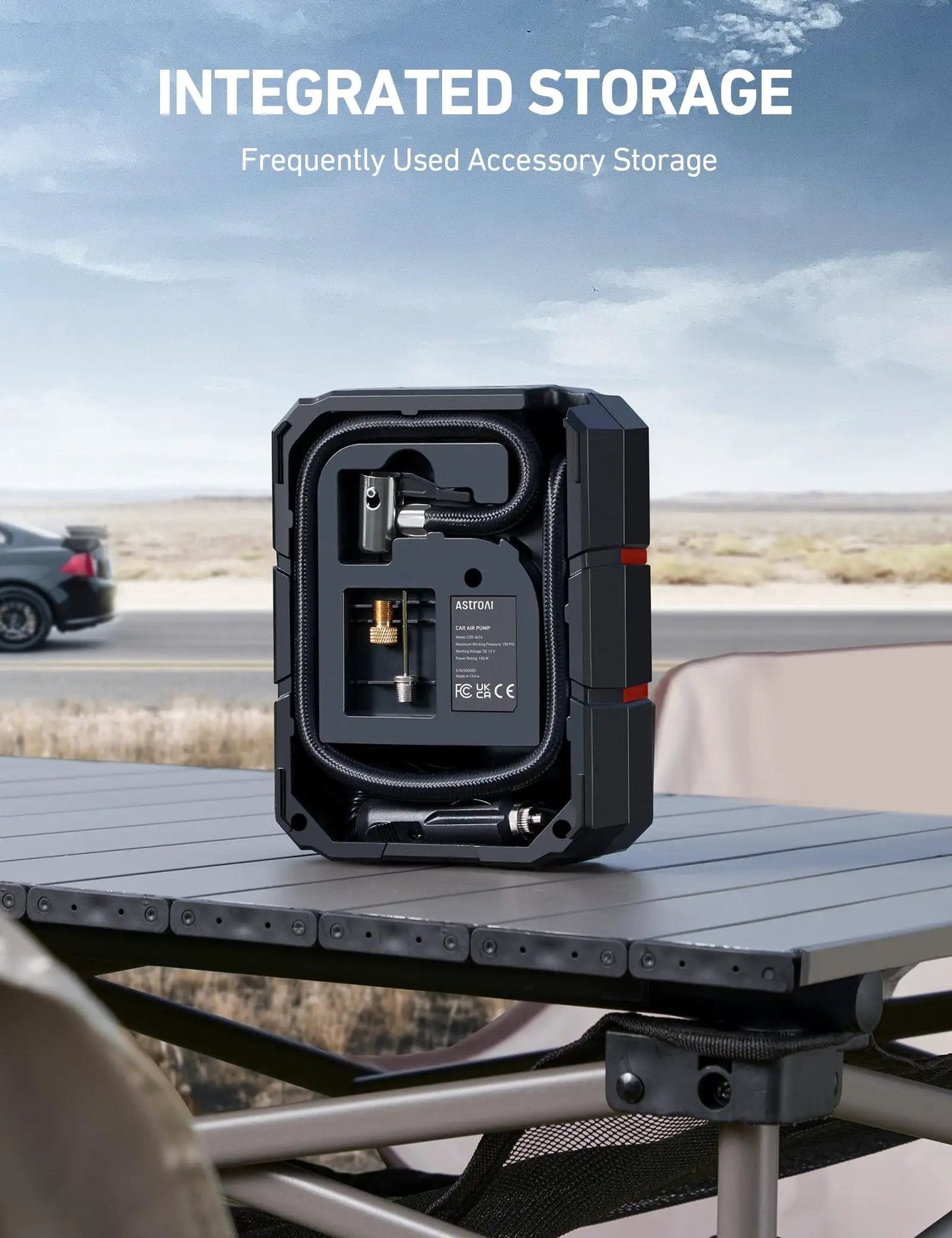 Portable 12V Tire Inflator With Digital Gauge And Auto Shutoff Preset To 150 PSI For Cars Motorcycles Bicycles And Inflatables On The Go Built In Quick Connect Nozzle AstroAI with open integrated storage on a table.