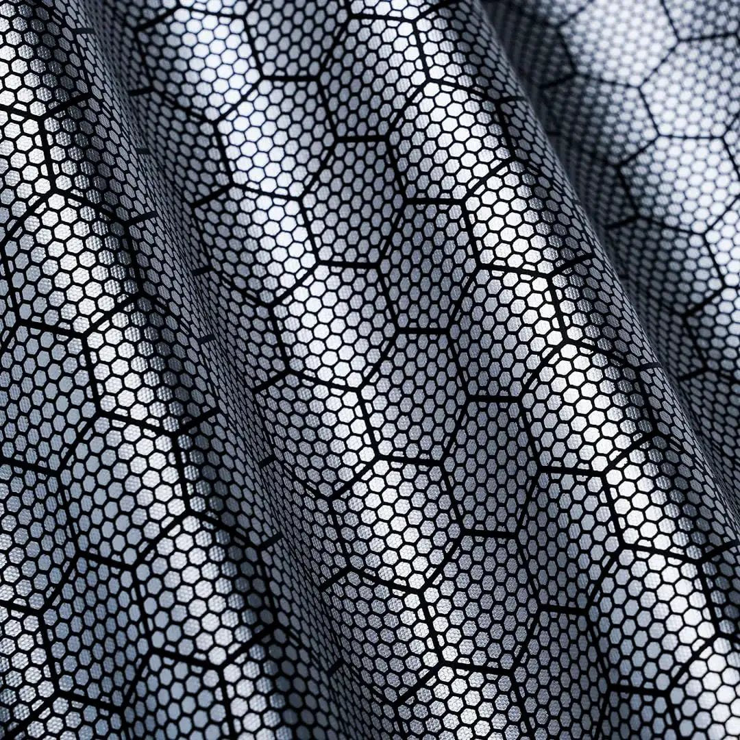Close-up of fabric pattern for R1S Roof Sunshade Two Piece Full Blackout for Rivian R1S, showing hexagonal mesh design.