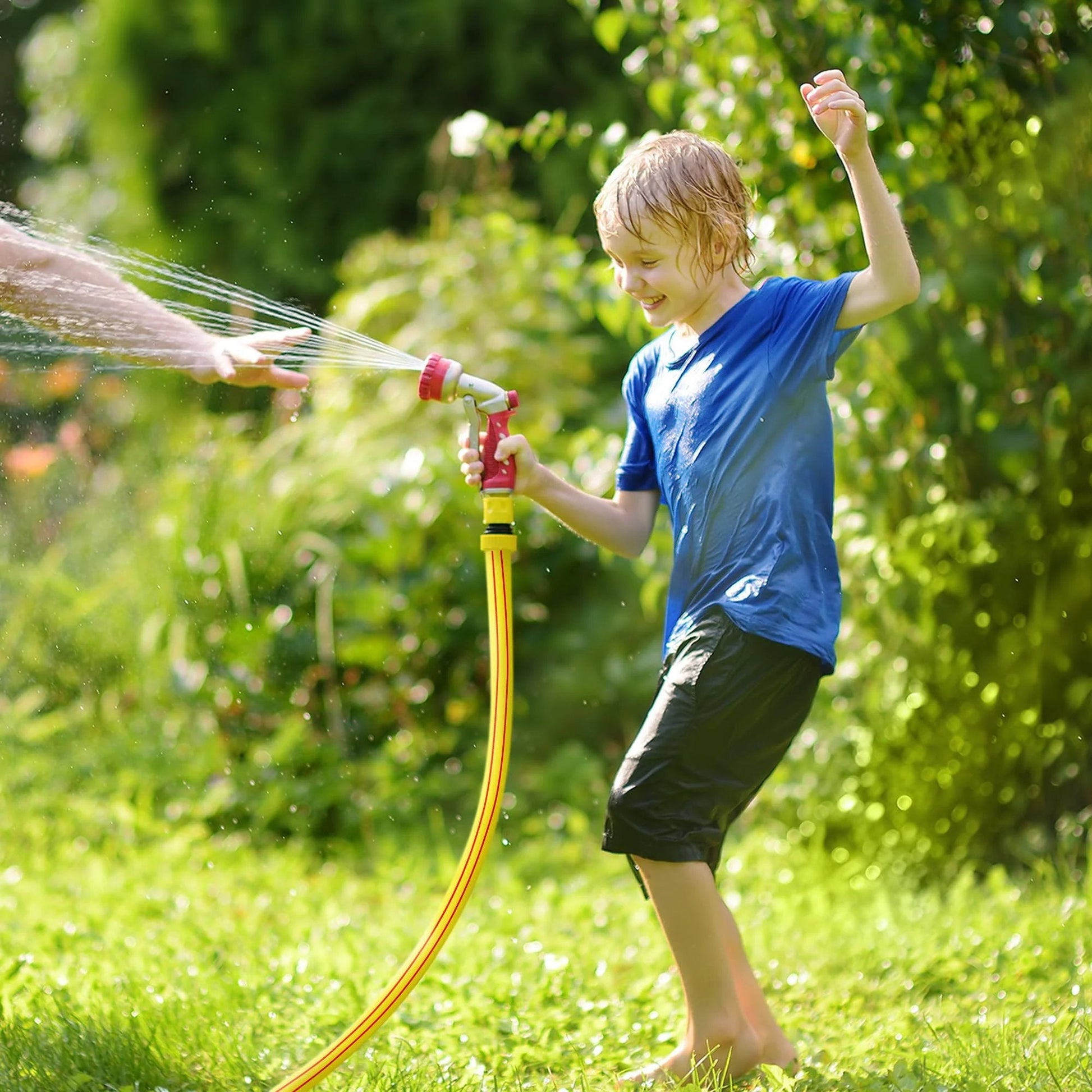 Child playing with Heavy Duty Short Garden Hose Five Eighth Inch Diameter, Four Foot Length, Lightweight Flexible Water Pipe For Household And Yard Use, Kink Free No Leaking With Brass And Aluminum Fittings Solution4Patio in garden