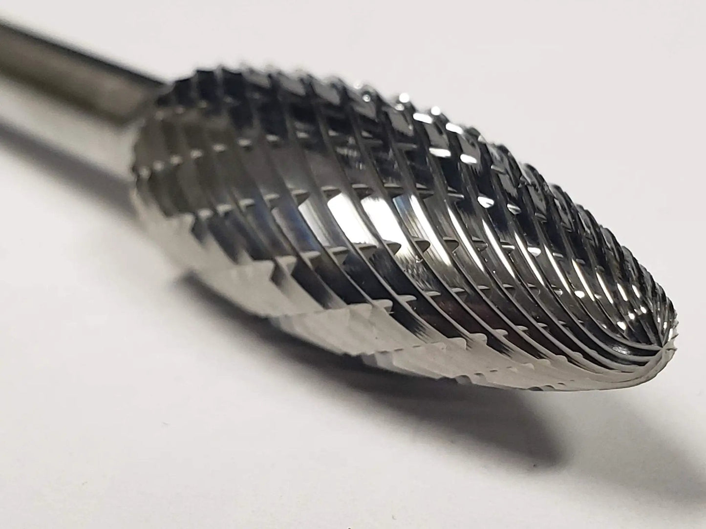 Close-up of 1/2 Inch SH-5 Burr Flame Style Double Cut Solid Carbide for metal workpieces on rotary tools