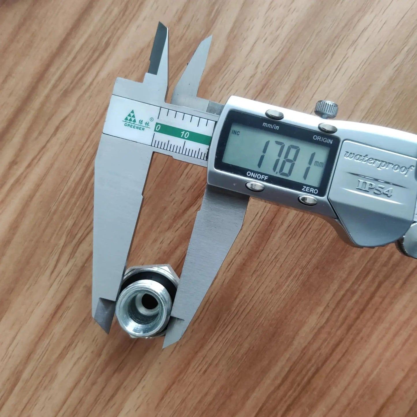 Close-up of Heavy Duty Hydraulic Hose Fitting Adapters for Excavator Built Tough with digital caliper measurement at 1.5mm port