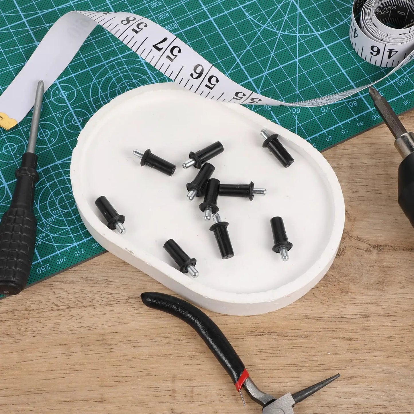 8 Piece Cabinet Door Repair Pins Set For Damper Replacement And Furniture Fittings, black plastic pins on white plate with tools