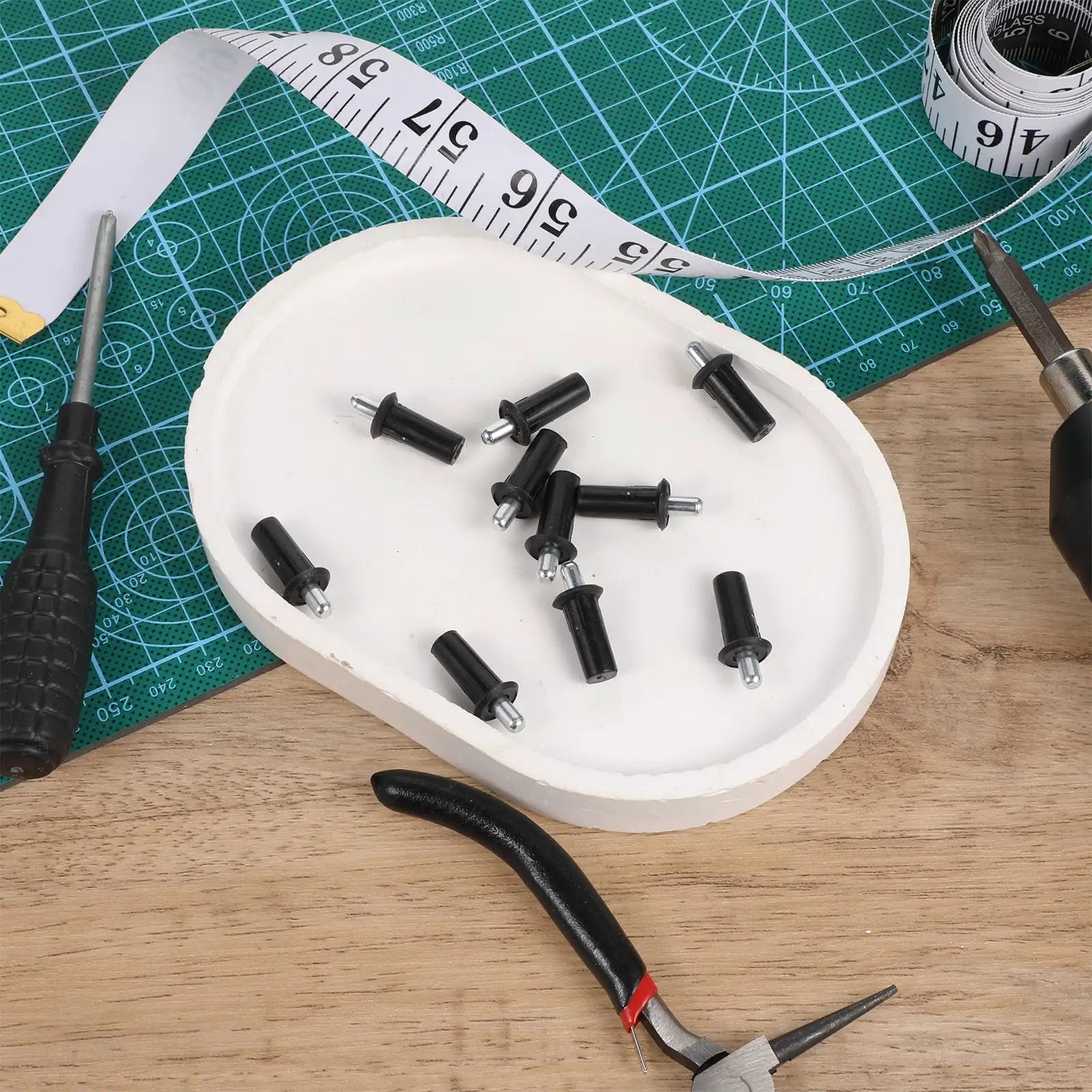 8 Piece Cabinet Door Repair Pins Set For Damper Replacement And Furniture Fittings, black plastic pins on white plate with tools