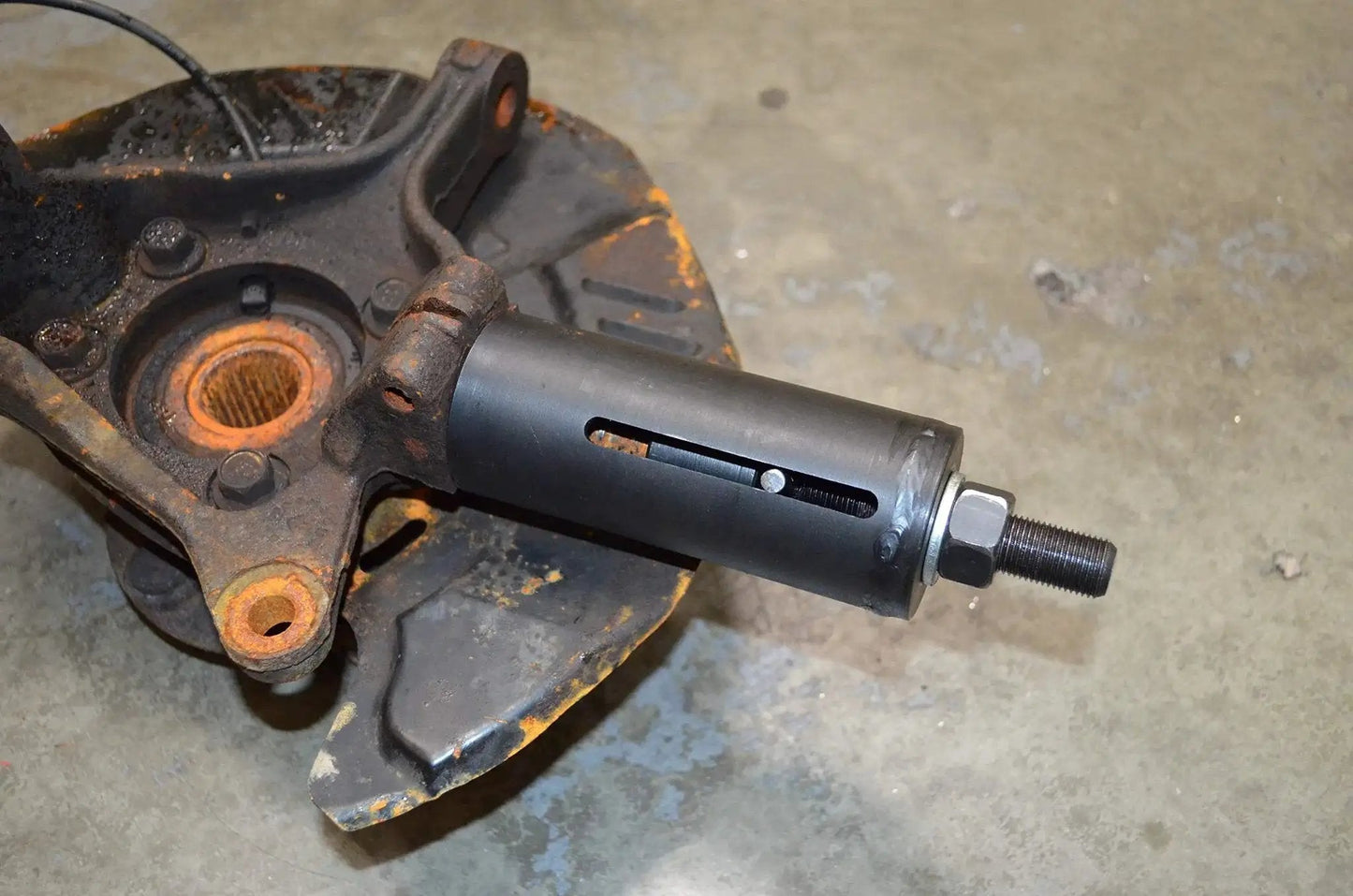 Ball Joint Puller Remover For Seized Subaru Vehicles With Slide Hammer Adapter on rusted suspension component