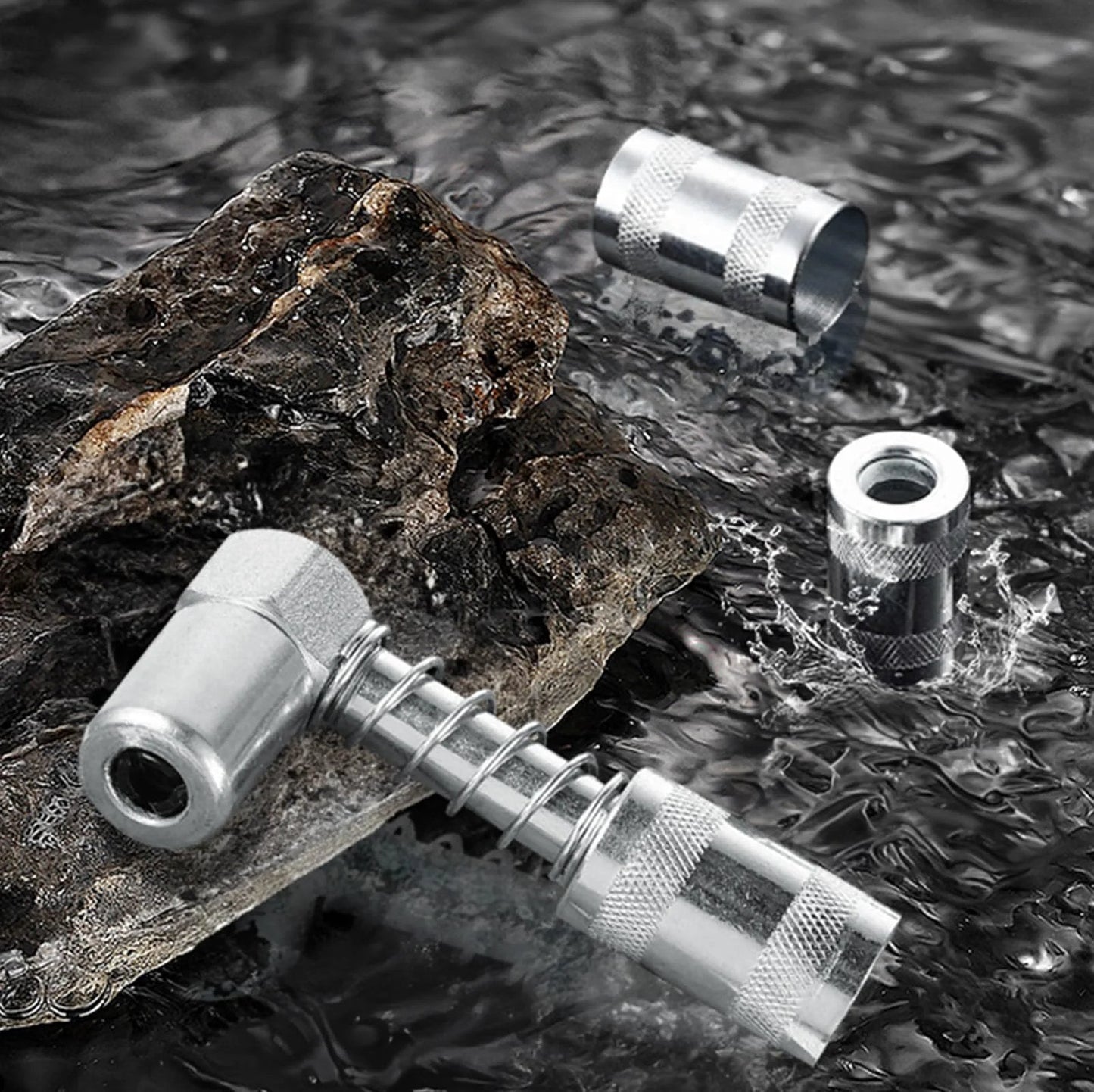 90 Degree Grease Coupler Gun Adapter For Hard To Reach Fittings shown on rock surface, metal build, angled design