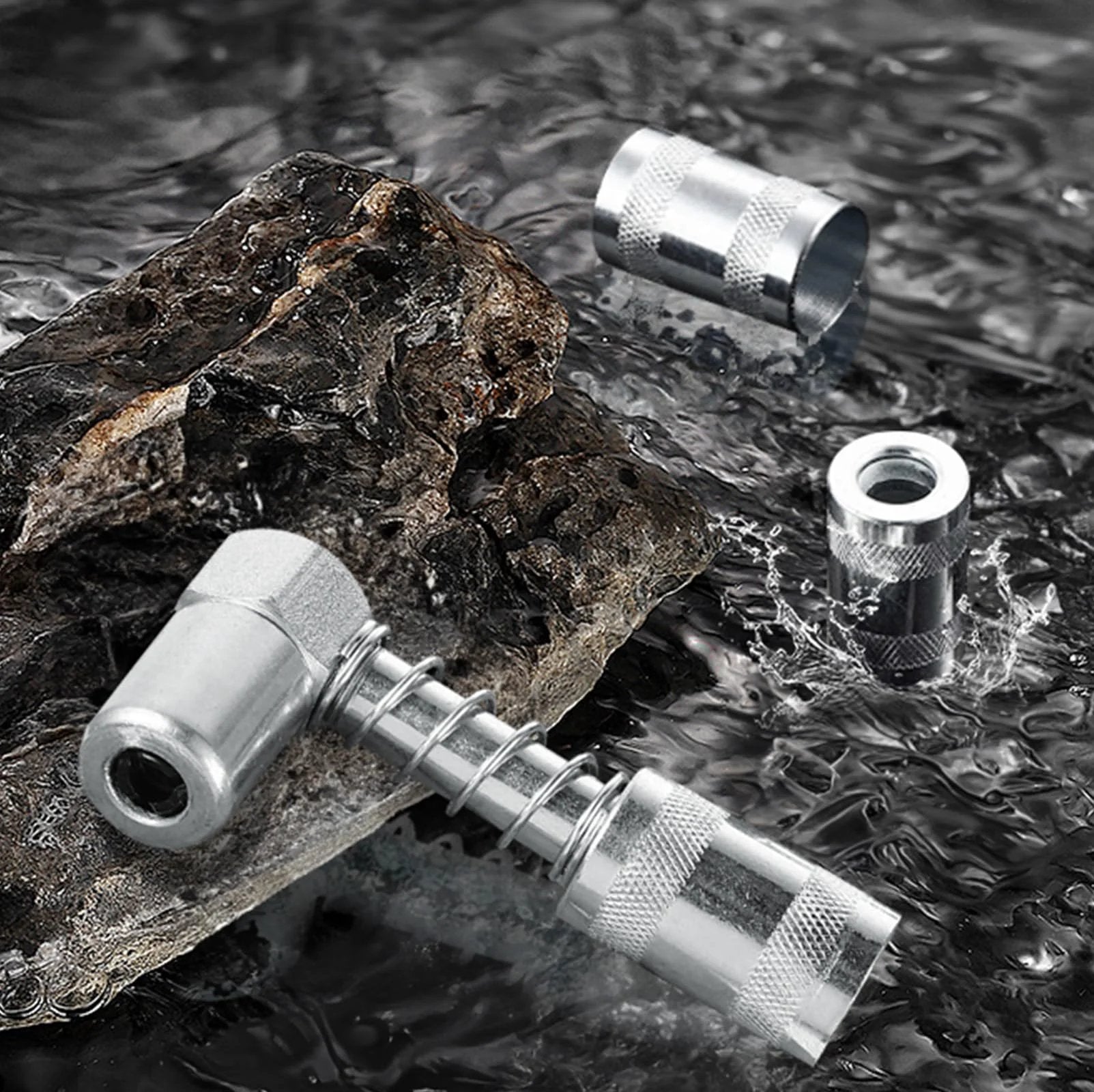 90 Degree Grease Coupler Gun Adapter For Hard To Reach Fittings shown on rock surface, metal build, angled design