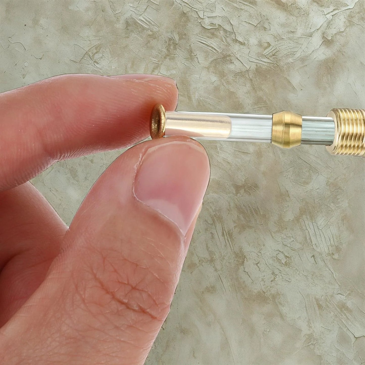 Close-up of Gold Tone Brass Compression Fittings Set For Tubing One Quarter Inch ID And Four Millimeter OD with brass inserts