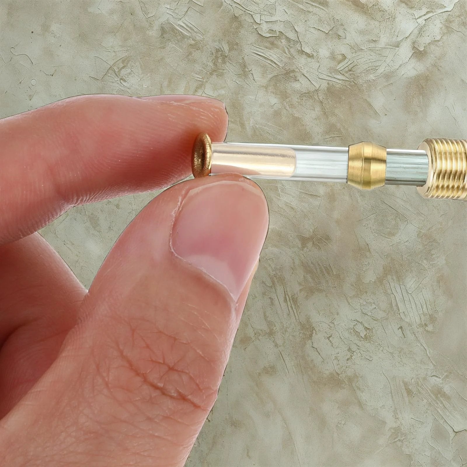 Close-up of Gold Tone Brass Compression Fittings Set For Tubing One Quarter Inch ID And Four Millimeter OD with brass inserts