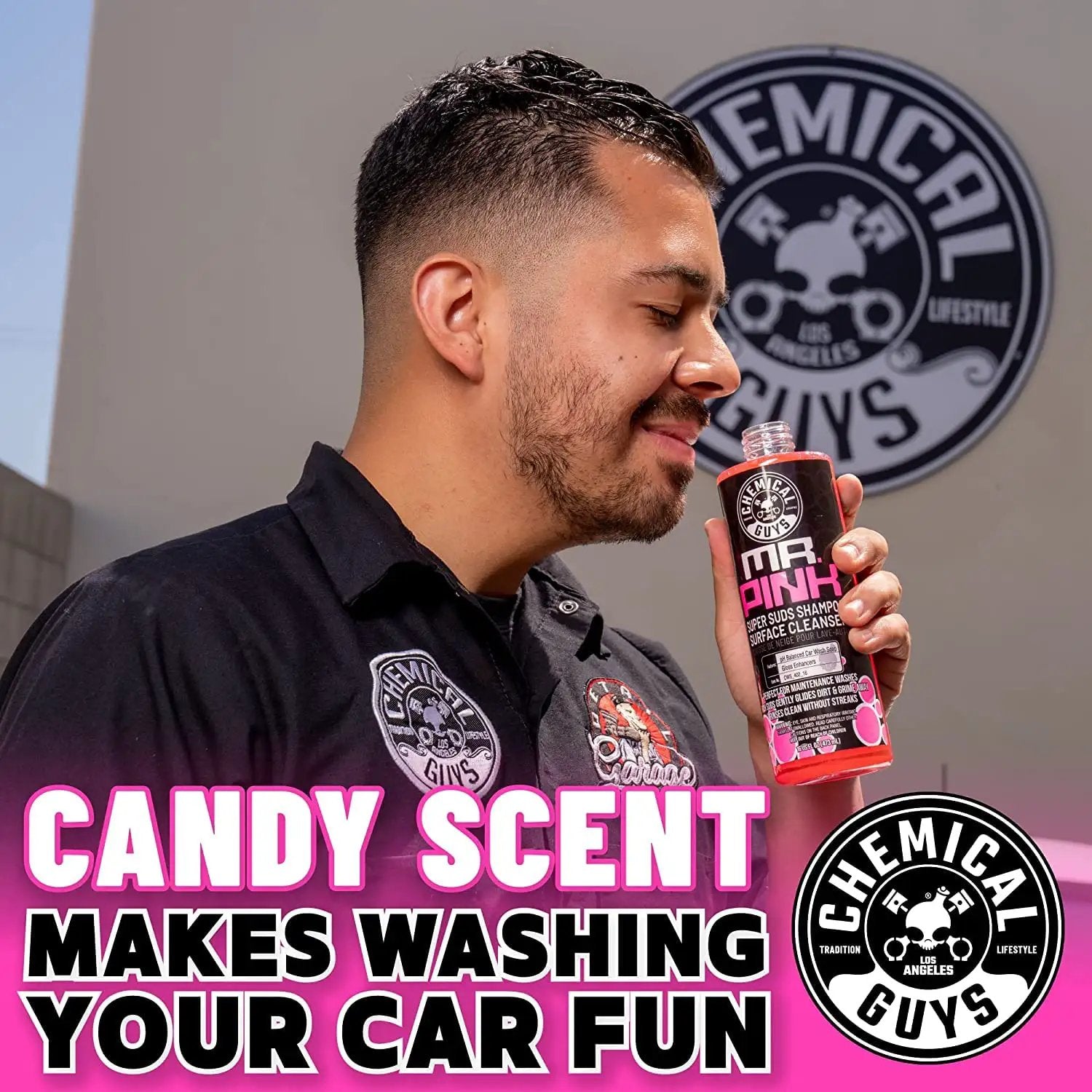 Man holding Mr Pink Foaming Car Wash Soap for Foam Cannons and Buckets, Safe for Cars Trucks Motorcycles RVs, Candy Scent, 473 ml by Chemical Guys.