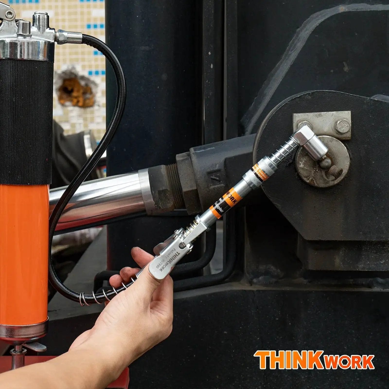 Using Grease Gun Coupler Set With Double Handle For Extra Reach And 90 Degree Adaptor One Eighth NPT Fittings On Machinery