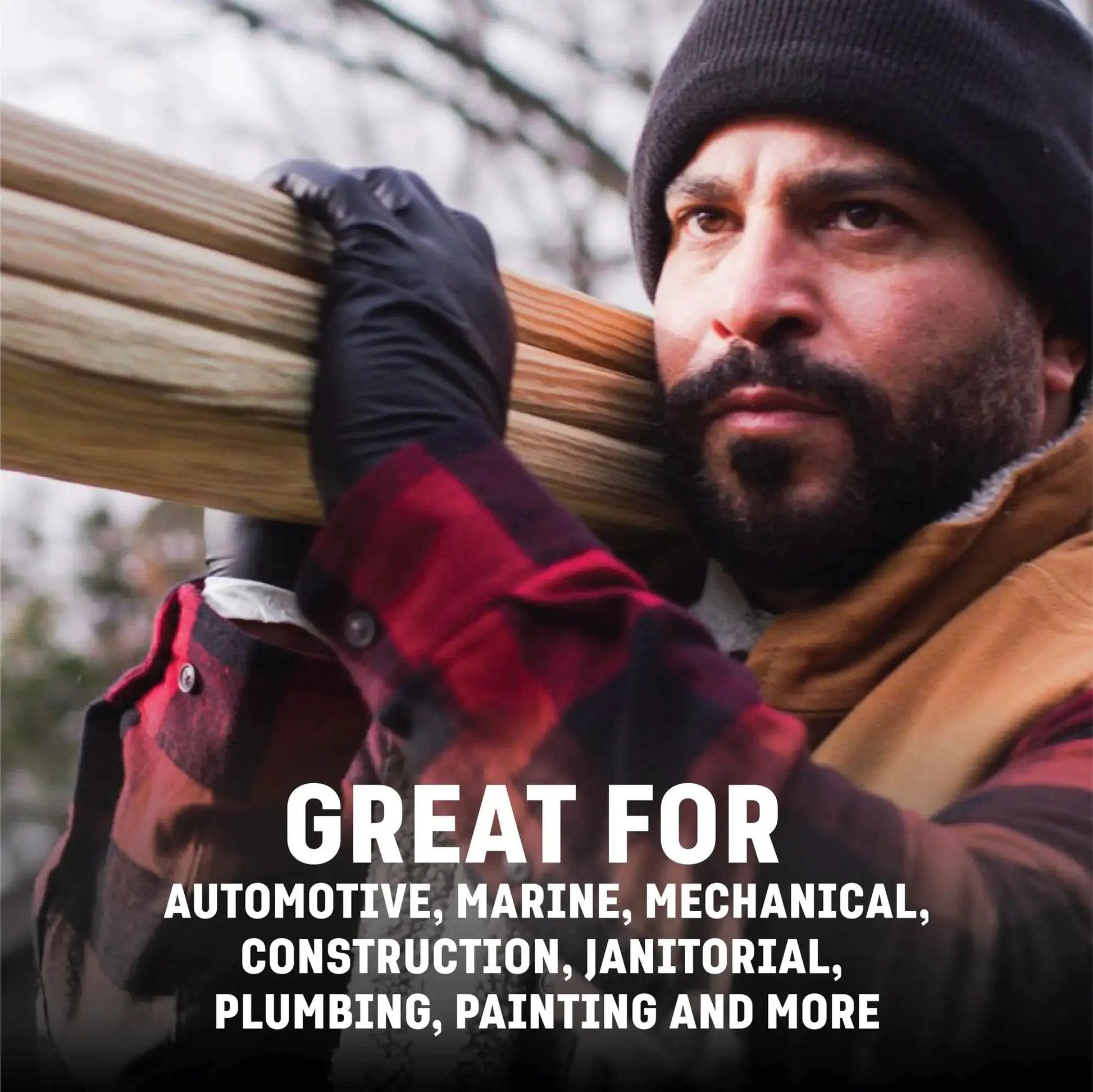 Man wearing Two Layer 6 Mil Nitrile Gloves Heavy Duty Chemical Resistant Black Textured Grip, holding wooden beams outdoors.