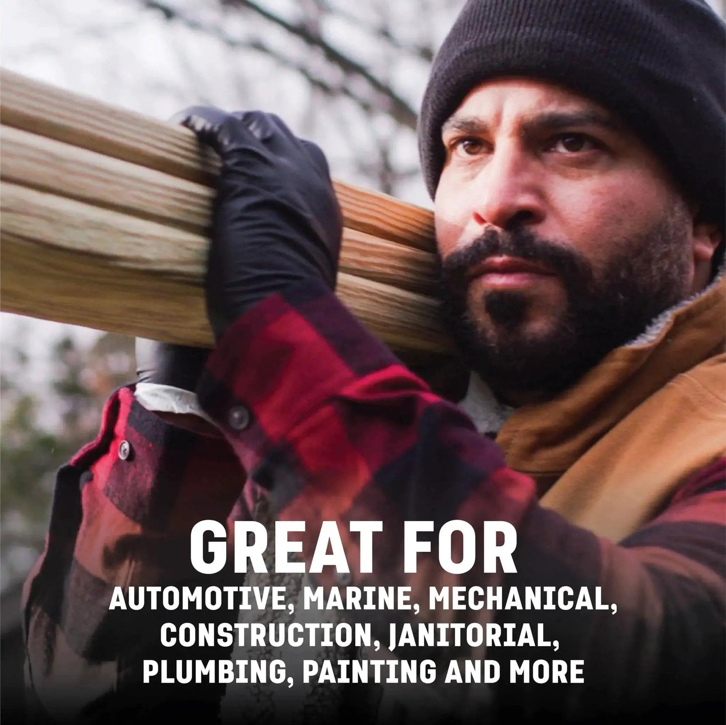 Industrial Nitrile Gloves 6 Mil Two Layer Rip Resistant 100 Count being used by worker holding wood outdoors