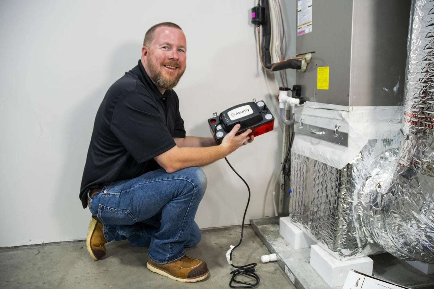 Technician installing Ultra Series Automatic Condensate Pump For HVAC And Refrigeration Equipment With Removable Check Valve 120 Volt Quiet Operation