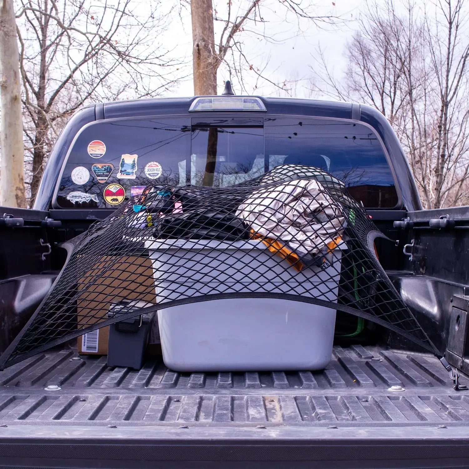 Elastic Cargo Net For Truck Bed And SUV Keeps Lightweight Loads In Place Without Tying Simple Mesh Organizer Fits All Trucks Vans ATVs UTVs SUVs From 4x4 To 7x7 Feet Black securing items in a truck bed.