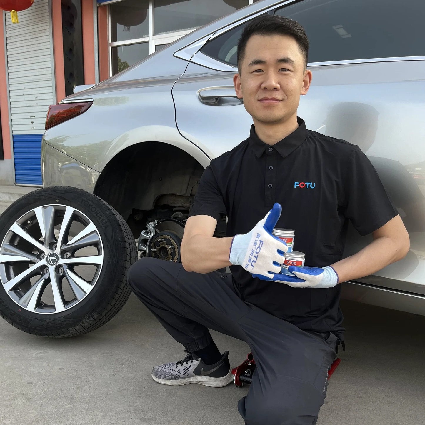 Mechanic with High Temperature Resistant Brake Caliper Guide Pin Lubricant For Smooth Braking And Long Lasting Performance Heavy Duty Suitable For Most Vehicles By FOTU 661 near car wheel.