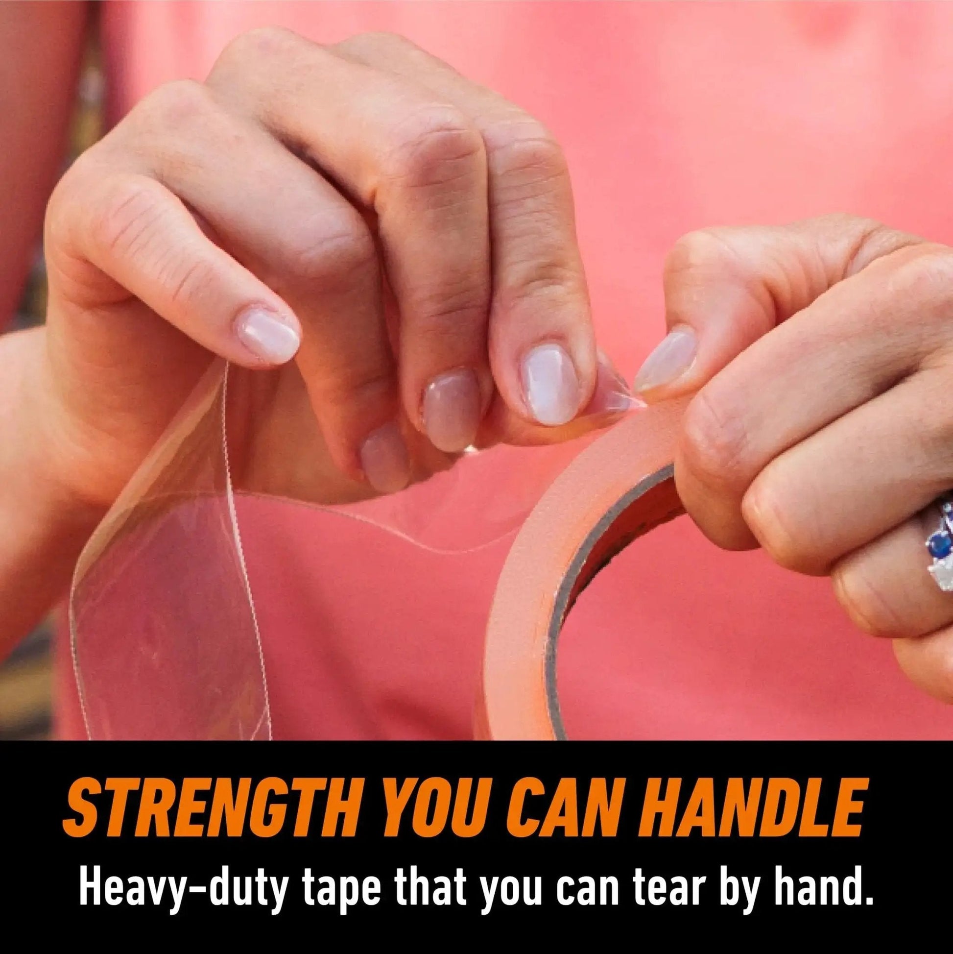Close-up of hands tearing Crystal Clear Tape 1.88 Inch By 18 Yard Weather Resistant Indoor Outdoor from roll