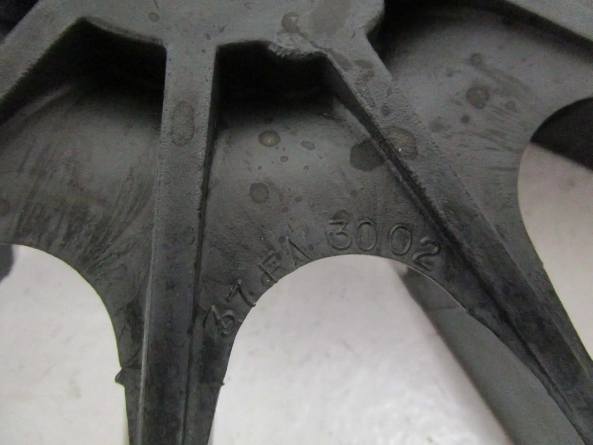 Close-up of 37FN3002A01SP EXFN plastic bearing sleeve with visible part number, showcasing precision fit design detail.