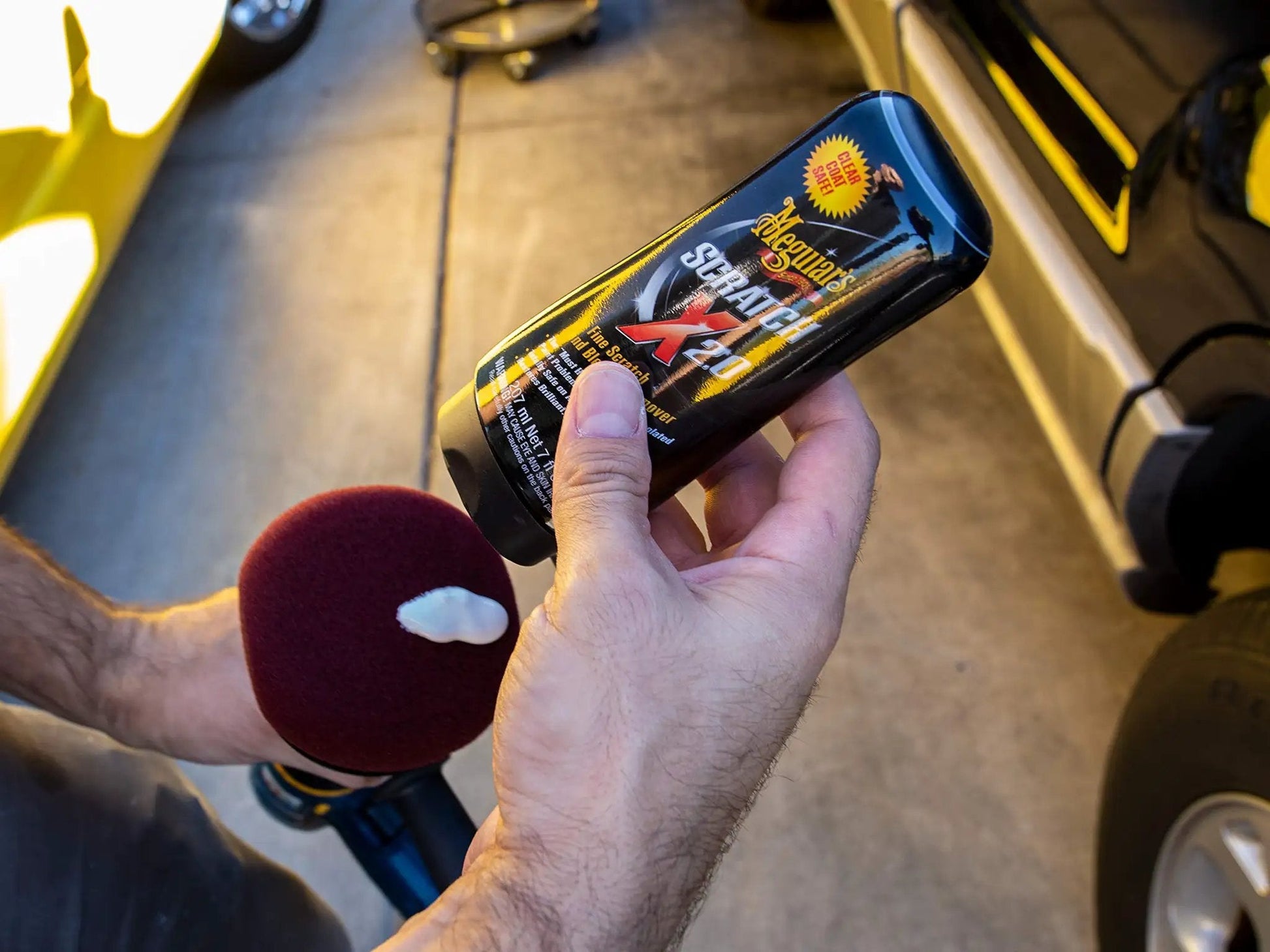 Car Scratch Fix That Kicks Out Paint Scratches and Swirls Without Messing Your Clear Coat Meguiars ScratchX 7 Oz Liquid in hand, showing label.