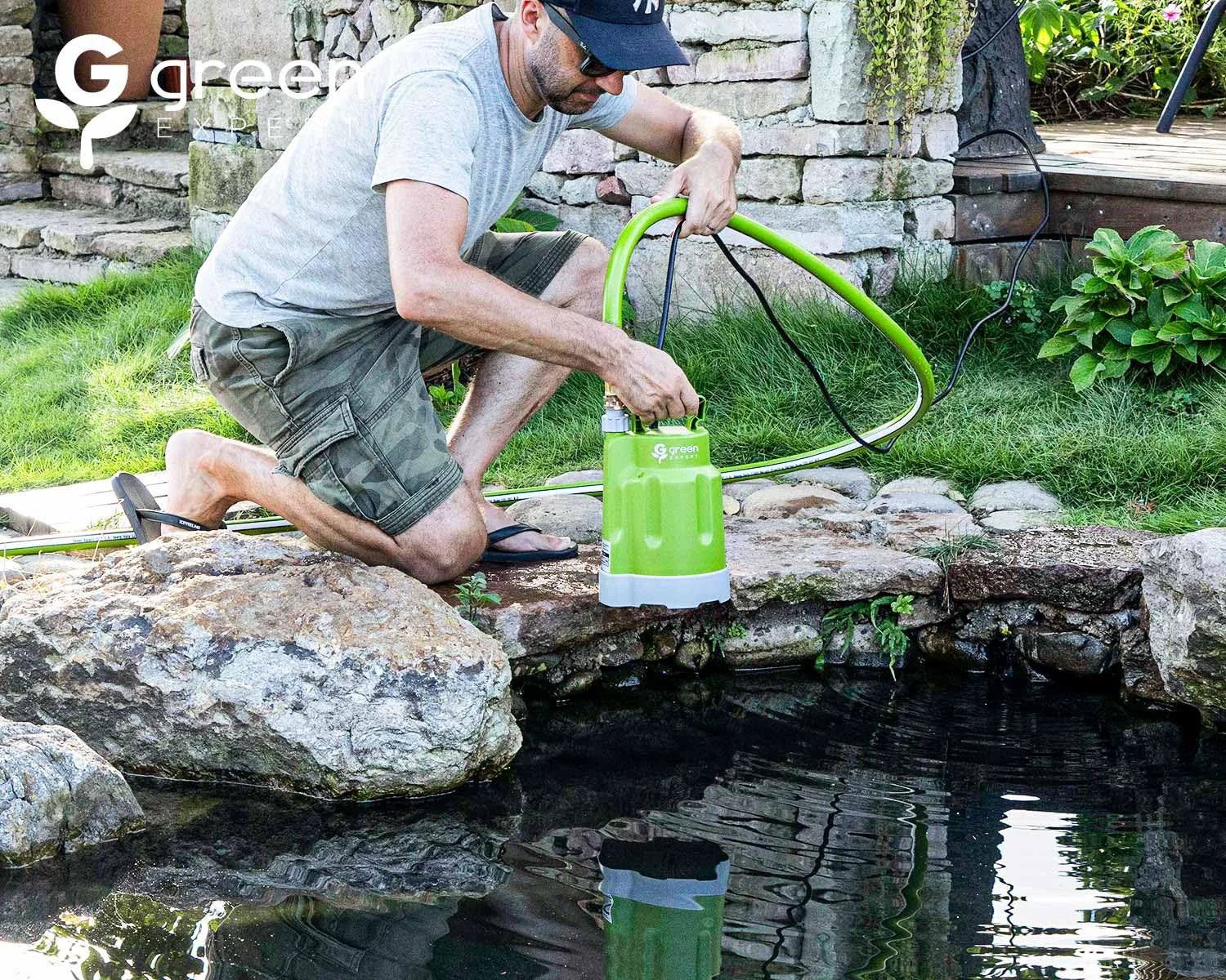 Person using Powerful Submersible Sump Pump For Fast Water Removal One Quarter HP 1800 GPH High Flow With 25 Foot Power Cord