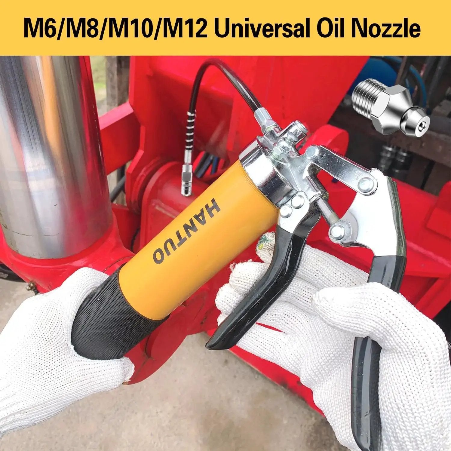 Heavy Duty Pro Grade Grease Gun With Quick Release Coupler 8000 PSI Pistol Grip Kit shown in use on red industrial machinery