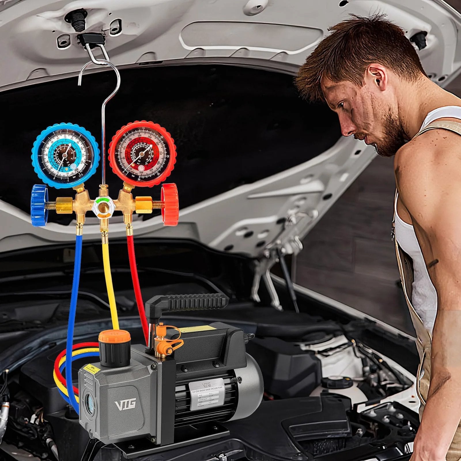 HVAC Vacuum Pump And Gauge Kit With Leak Detector For Mini Split And Auto Systems in use on car engine