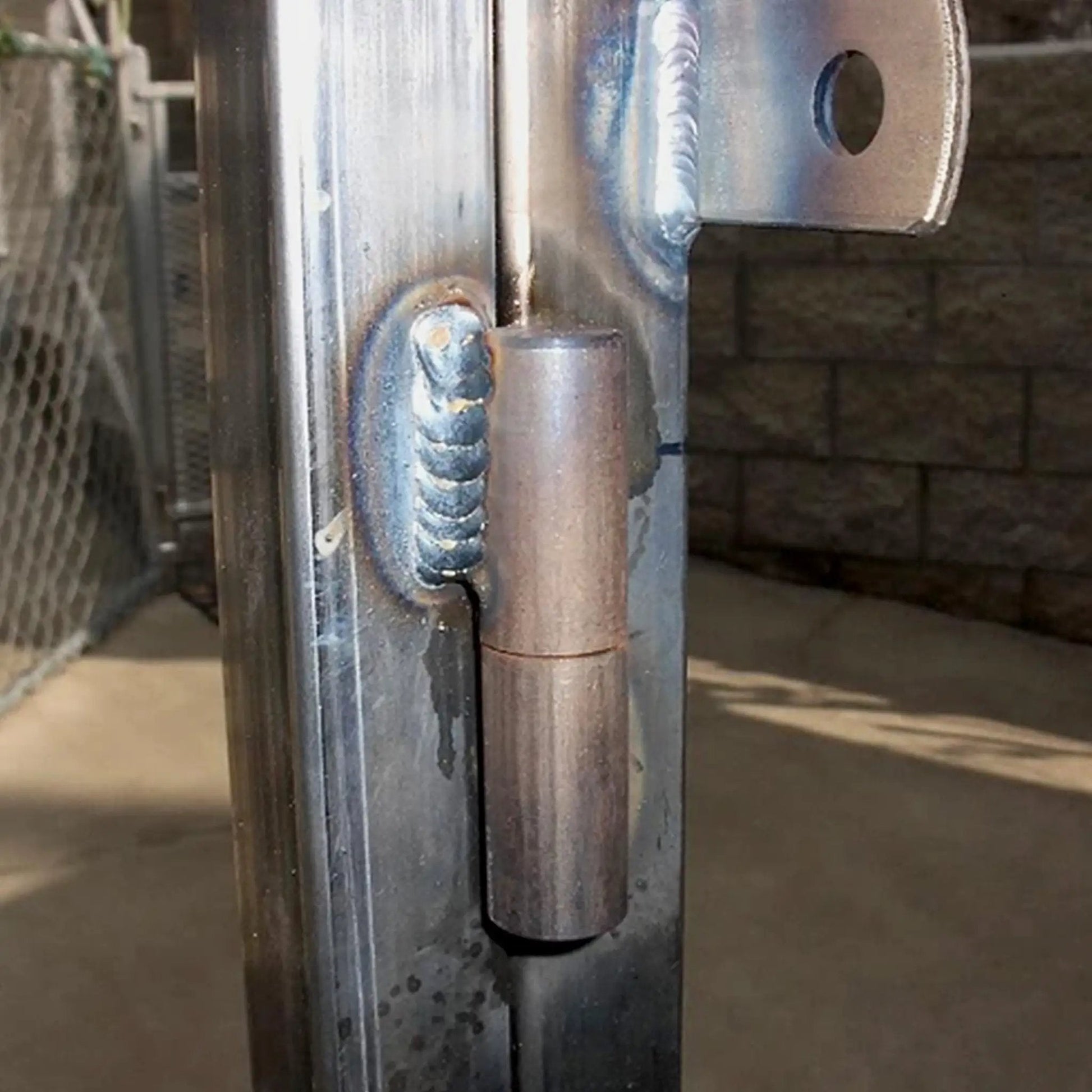 Side view of installed 8 Pack 2 Inch Weldable Barrel Hinges Heavy Duty Steel Weld On Bullet Door Hinges Detachable For Metal Swing Doors Gates And Glass Doors With 11 32 Inch Pin Bearing on metal gate.