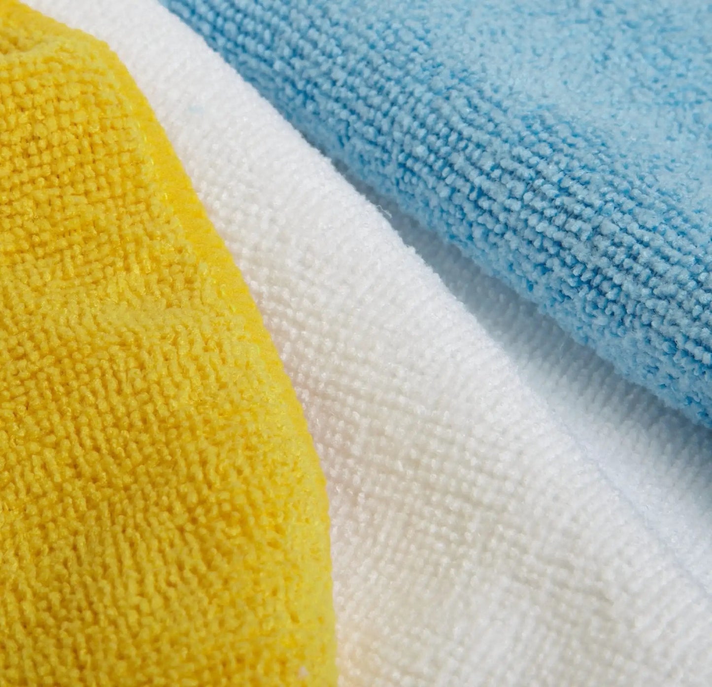 Close-up of colorful Ultra Absorbent Microfiber Cleaning Cloths For Cars And Home Go To, 24 Pack, 16 By 12 Inches, Non Abrasive Lint Free Streak Free Reusable And Washable, Colorful Blue White Yellow, Amazon Basics.