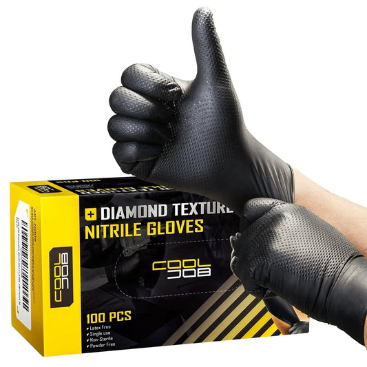 Gloved hands wearing 8 Mil Disposable Nitrile Gloves With Diamond Textured Grip 100 Count, showing thumbs up next to the packaging.