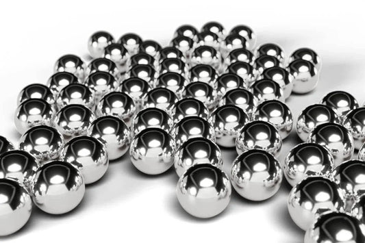 Shiny 8mm Bearing Balls 304 Stainless Steel G100 Precision Balls 55pc laid out, reflecting light on smooth surface.