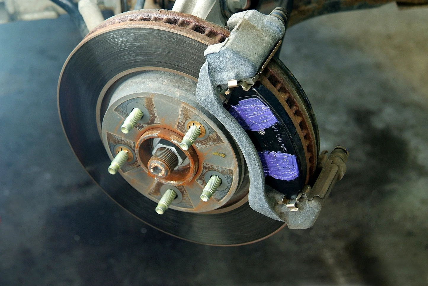 Disc brake system with Ceramic Extreme Brake Parts Lubricant for Disc and Drum Systems, 8 Oz from Permatex applied on pads