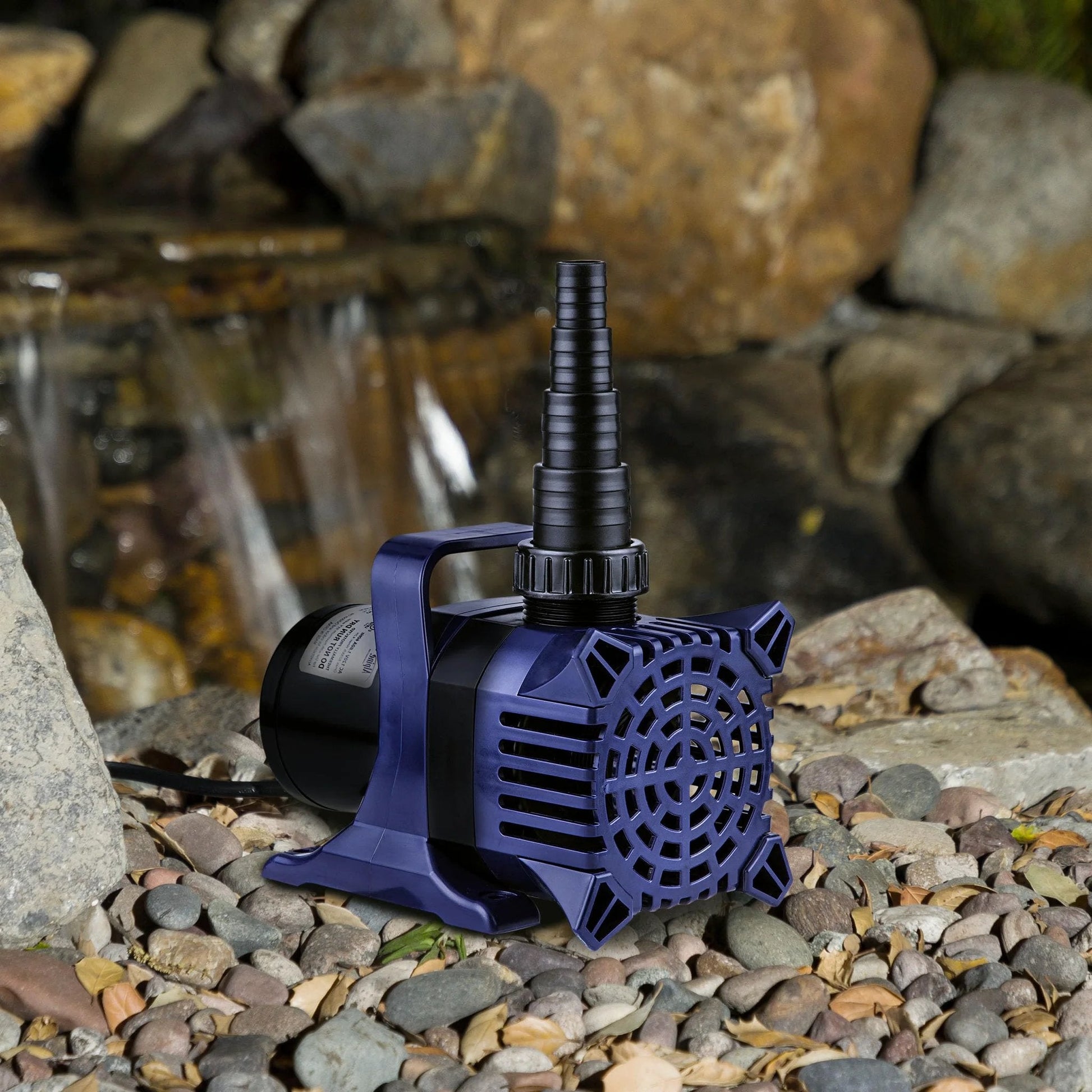 Powerful Submersible Pond Pump with 6550 GPH and Quiet 456W Motor in natural setting with rock background