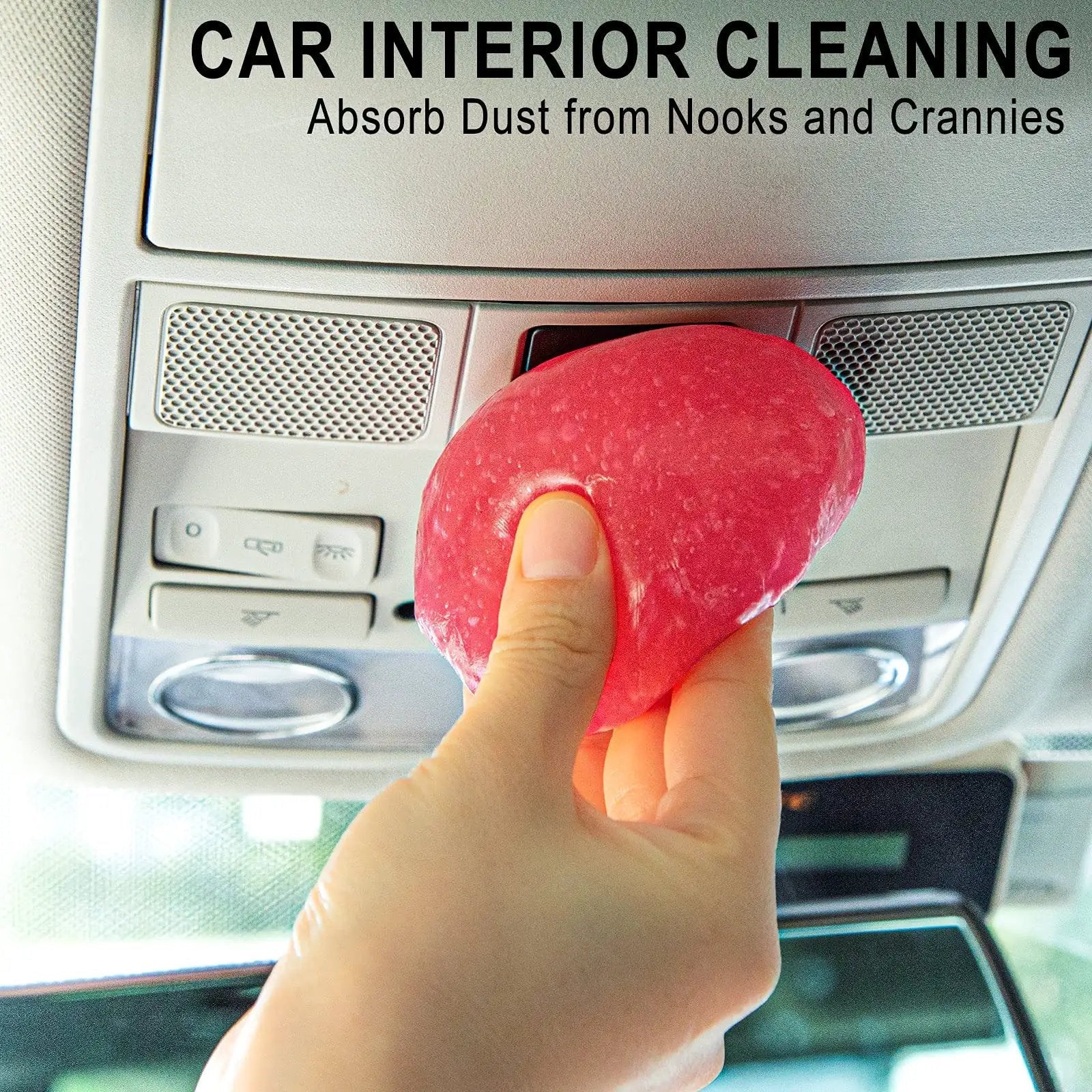 Hand using Rose Red Car Cleaning Gel Putty for Detailing And Interior Cleaning Reusable Slime in car interior.