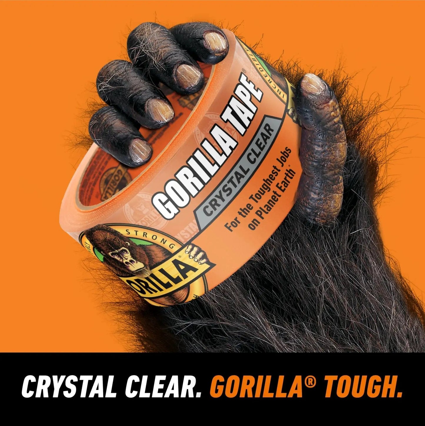 Gorilla hand holding Crystal Clear Tape 1.88 Inch By 18 Yard Weather Resistant Indoor Outdoor in orange packaging