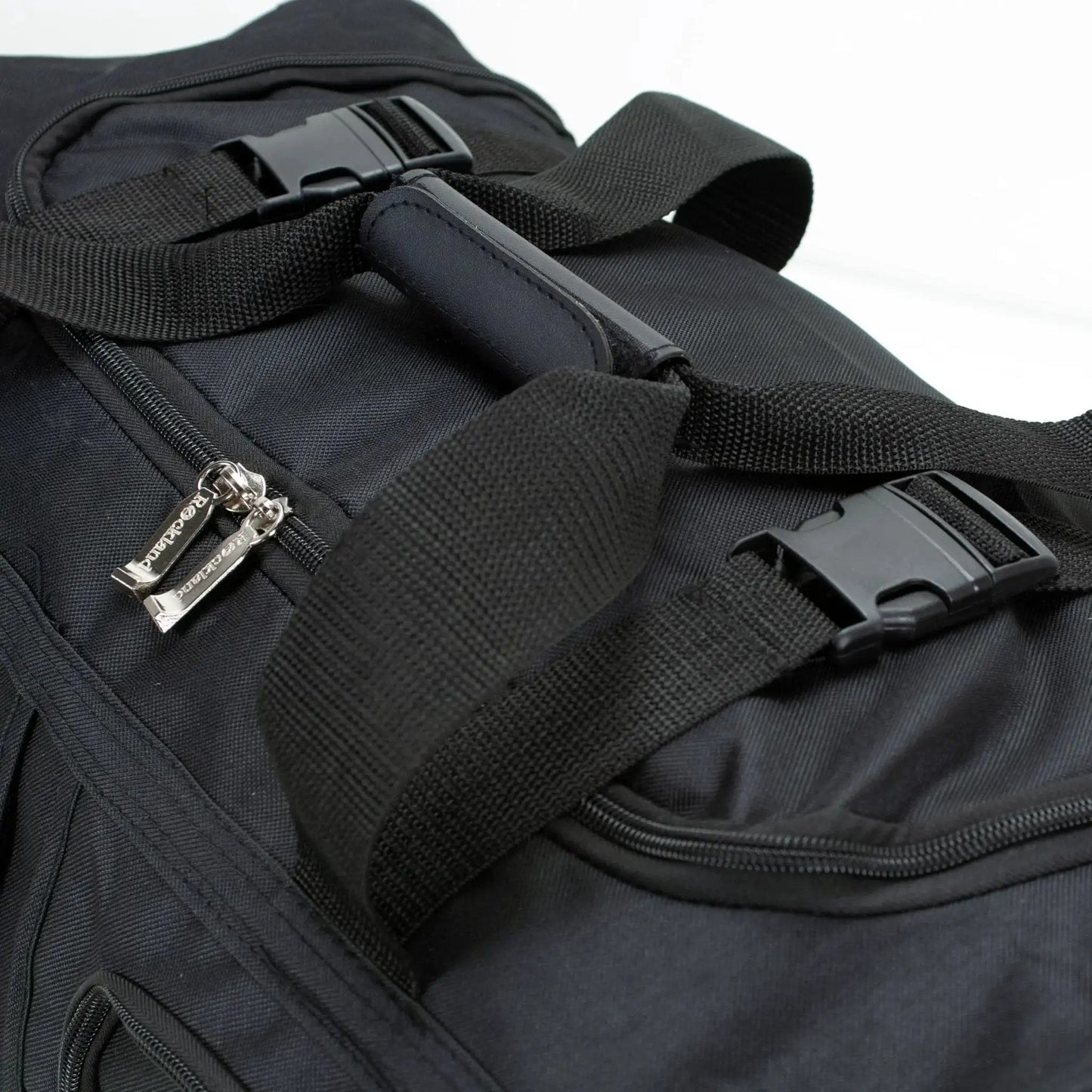 Close-up of heavy-duty zipper on Rolling Duffel Bag With Extra Large Wheels And A Wide U Shaped Opening, Sleek Black 22 Inch Soft Sided Luggage