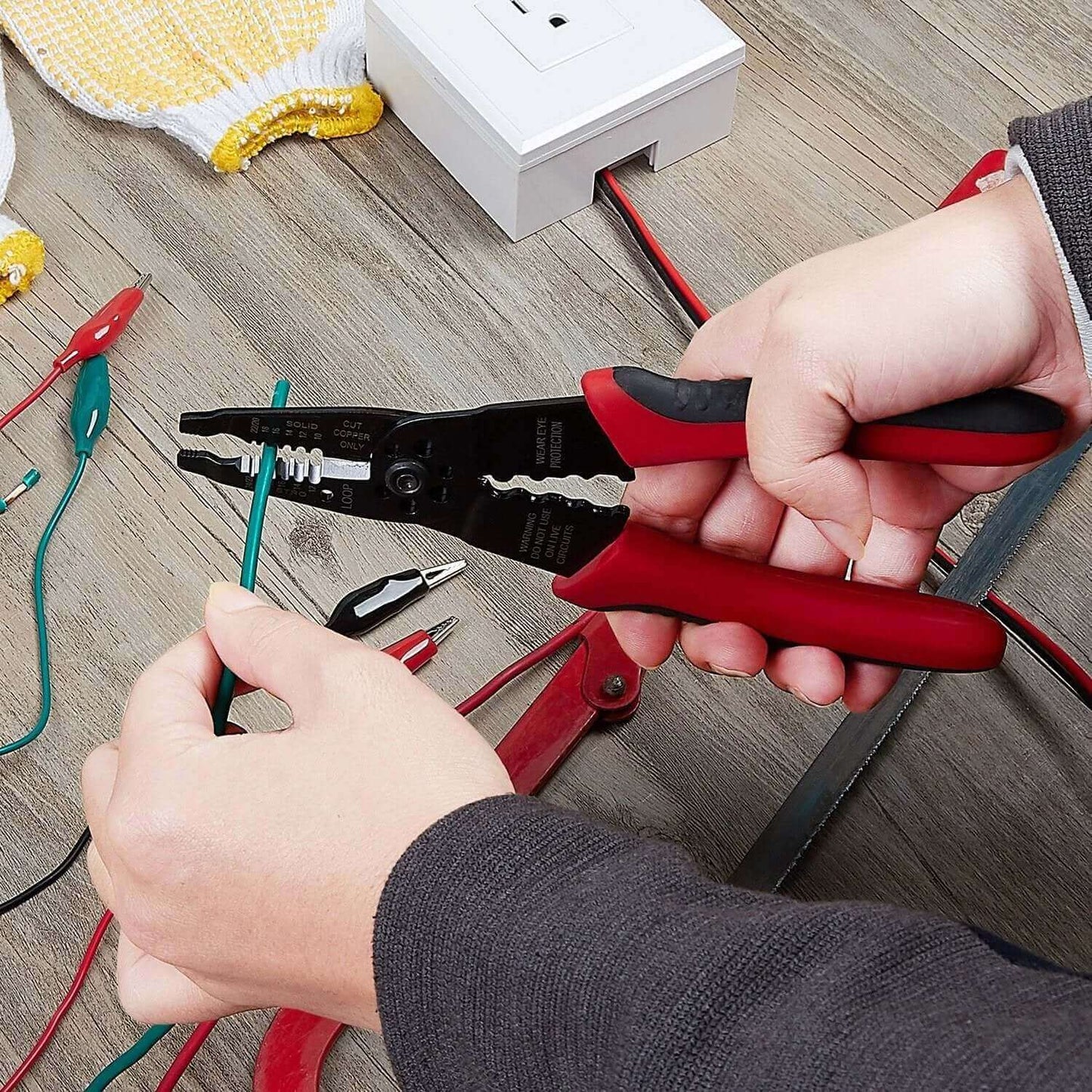 Person using 8 Inch Professional Wire Stripper and Crimping Tool for 10 to 22 AWG Solid Copper and Aluminum Cable, ergonomic design